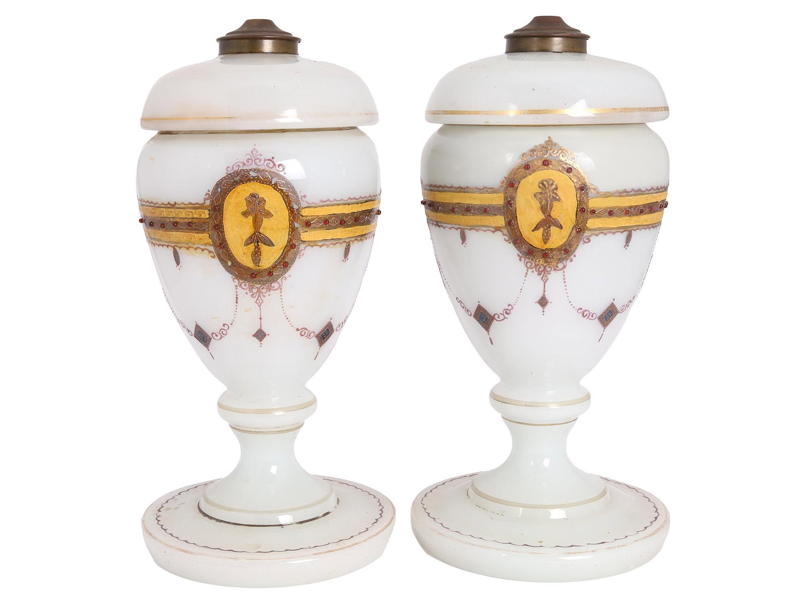 PAIR OF ANTIQUE WHITE OPALINE GLASS LIDDED VASES: A pair of antique 19th century French footed floor vases or jars with lids made of white opaline glass. The lids have long flanges and patinated copper tops. A hand-painted golden and pink ornamental 