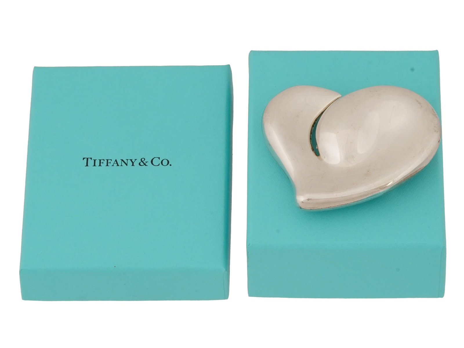 ELSA PERETTI FOR TIFFANY STERLING SILVER BELT BUCKLE: A sterling silver belt buckle by Tiffany and Co. Design by Elsa Peretti, 1940 to 2021, an Italian jewelry designer. Signature heart design. Marked Peretti, Tiffany and Co., Italy, 1978, Sterling, 925 