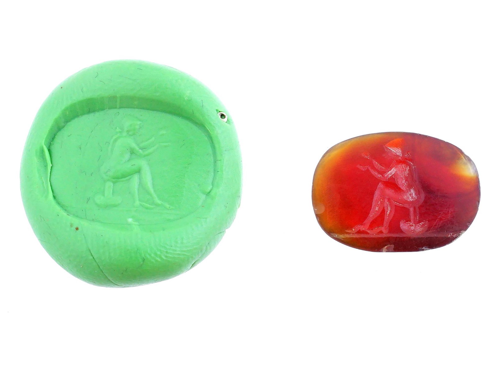 CARVED STONE INTAGLIO WITH ANCIENT ROMAN STYLE EROTIC SCENE: A carved stone intaglio featuring a detailed ancient Roman style erotic scene. Such intaglios were used as personal seals, amulets, or decorative jewelry, showcasing the Romans appreciation for mythol