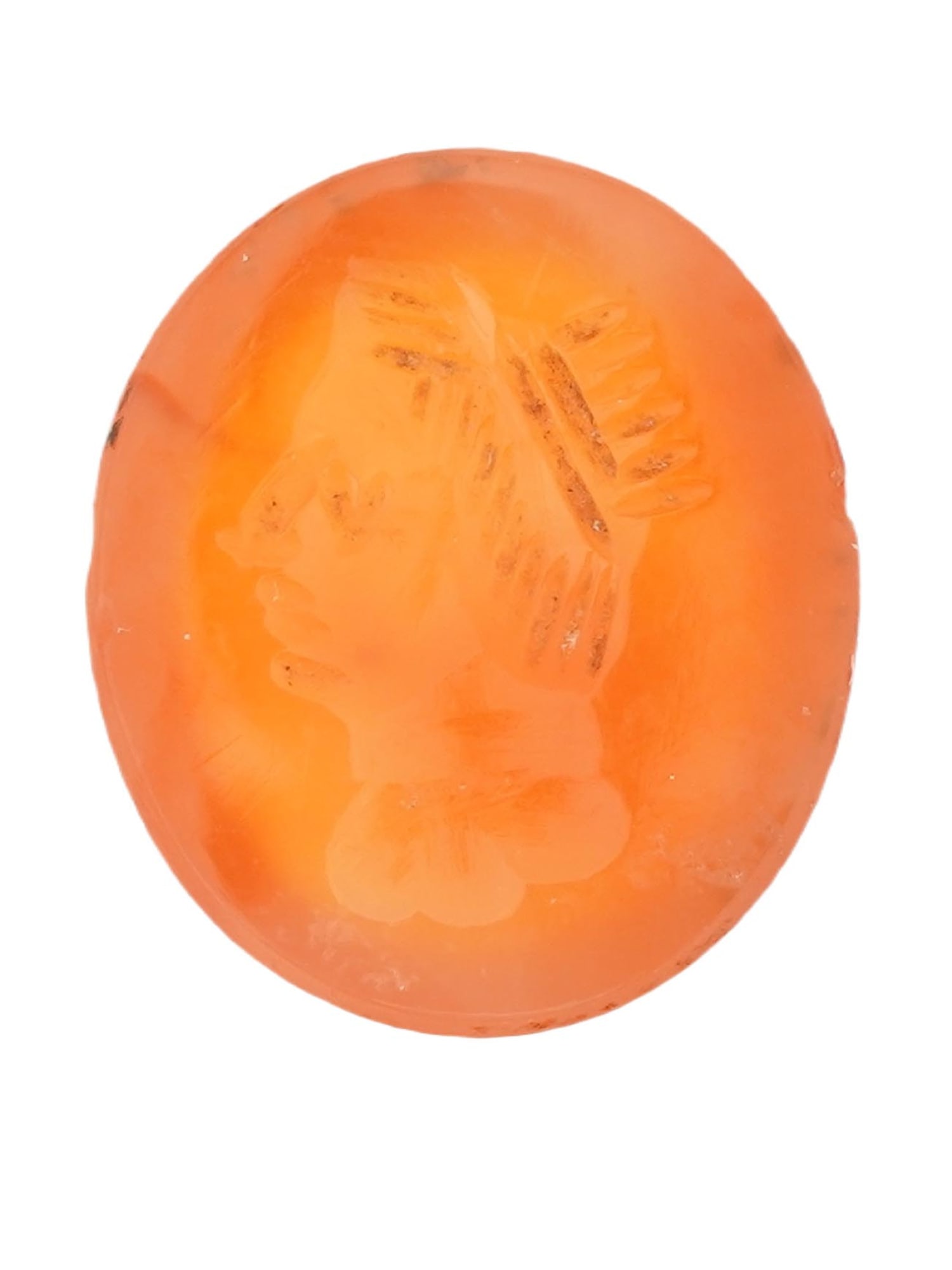 ROMAN MANNER HAND CARVED CARNELIAN STONE INTAGLIO: A hand carved Carnelian stone Intaglio depicting a profile portrait probably a warrior in the ancient Roman manner. Oval in shape. The reverse side is flat. Antique and Vintage Jewelry Wares and Acces
