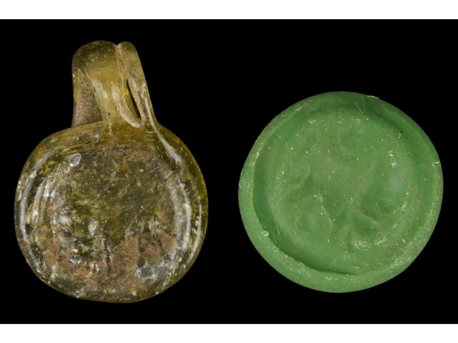 ANCIENT ROMAN EMPIRE GLASS PENDANT OF LION ZODIAC: An Ancient Roman glass pendant. Imperial Rome era, ca. 100 to 300 AD. The medallion represents the Zodiac sign of Lion, crescent and star. Green glass shade. Collectible Archaeological Finds And Relic