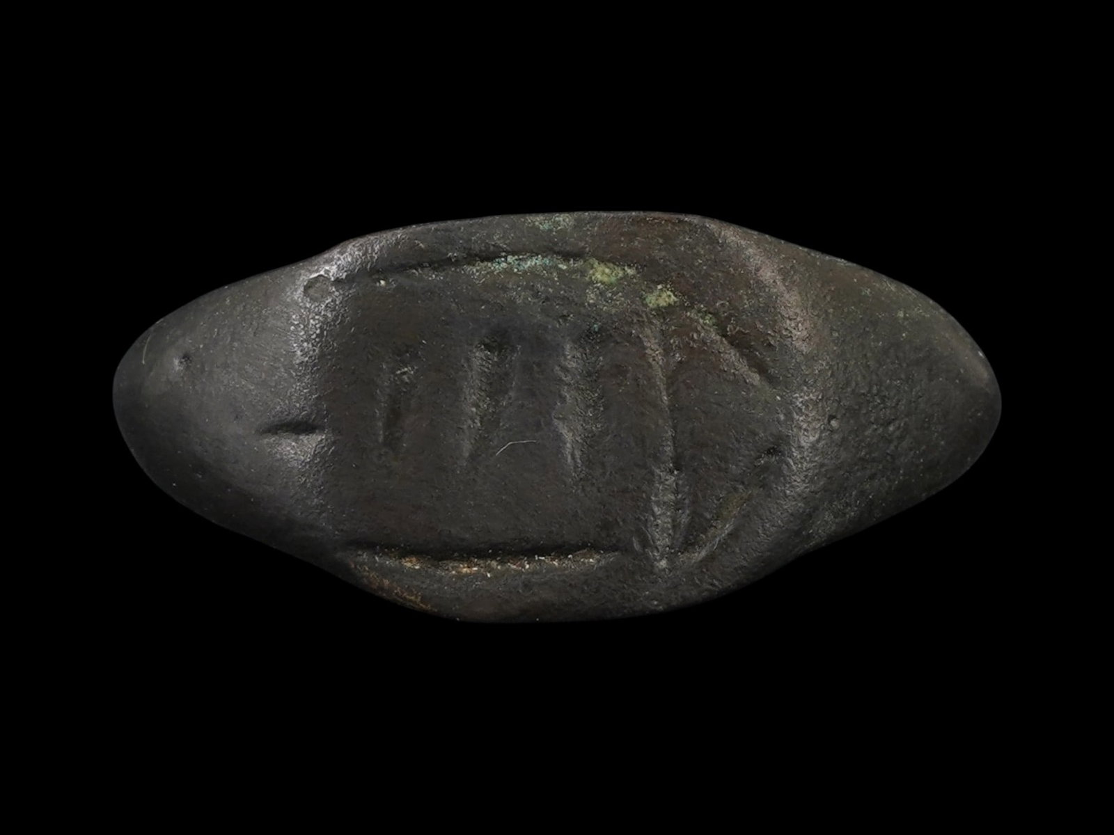ANCIENT ROMAN JUDAICA BRONZE RING WITH A TEMPLE MOTIF: An ancient Roman Judaica bronze ring, dating to approximately 300 to 100 BC. The bezel is engraved with a temple motif associated with ancient religious symbolism and craftsmanship. Ancient Artifact A