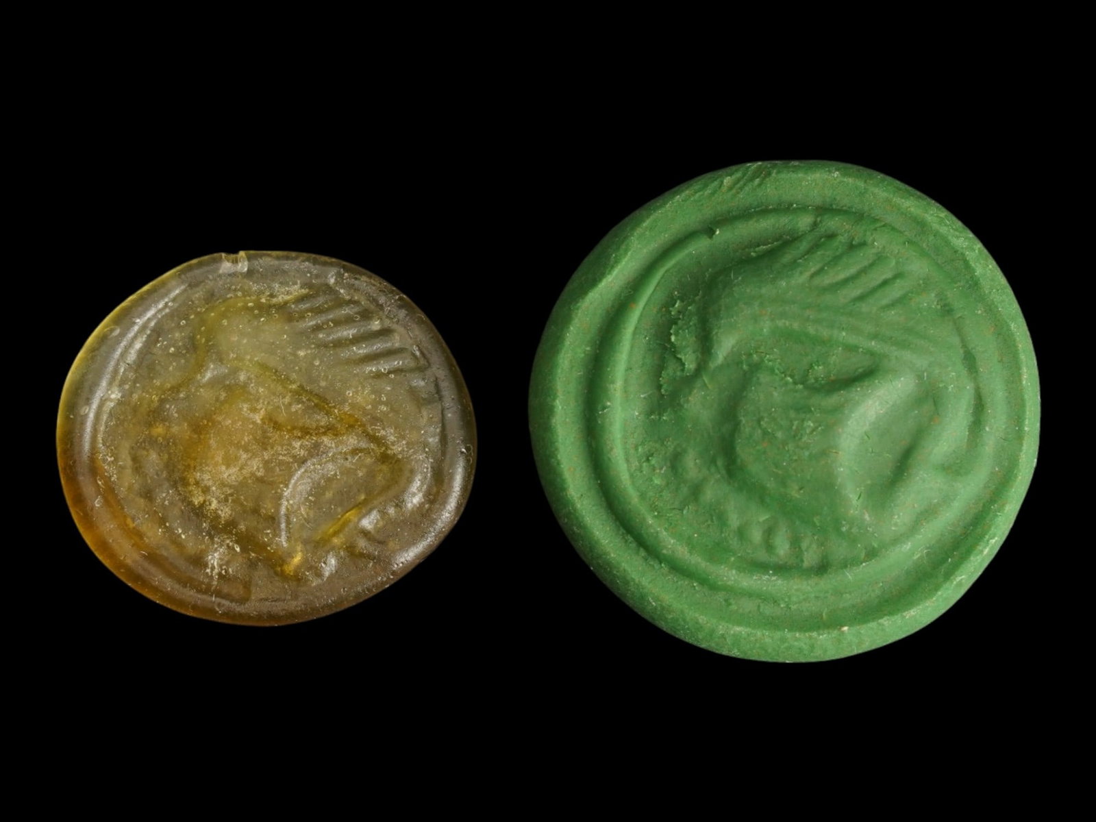 ANCIENT ROMAN EMPIRE GLASS MEDALLION SEAL OF A SHIP: An Ancient Roman glass medallion or stamp seal. Imperial Rome era, ca. 100 to 300 AD. The medallion represents a sailing ship. Yellow-green glass shade. Collectible Archaeological Finds And Relics, Ro