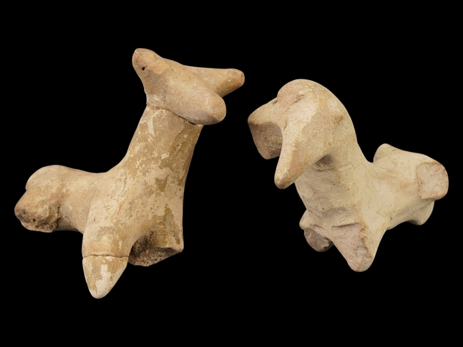 TWO ANCIENT HITTITE TERRACOTTA POTTERY FIGURINES: A lot of two ancient Hittite terracotta pottery figurines, dating from the Late Bronze Age between 1600 and 1100 BC. The figurines are modeled in the form of stylized animals, possibly horses or rams.