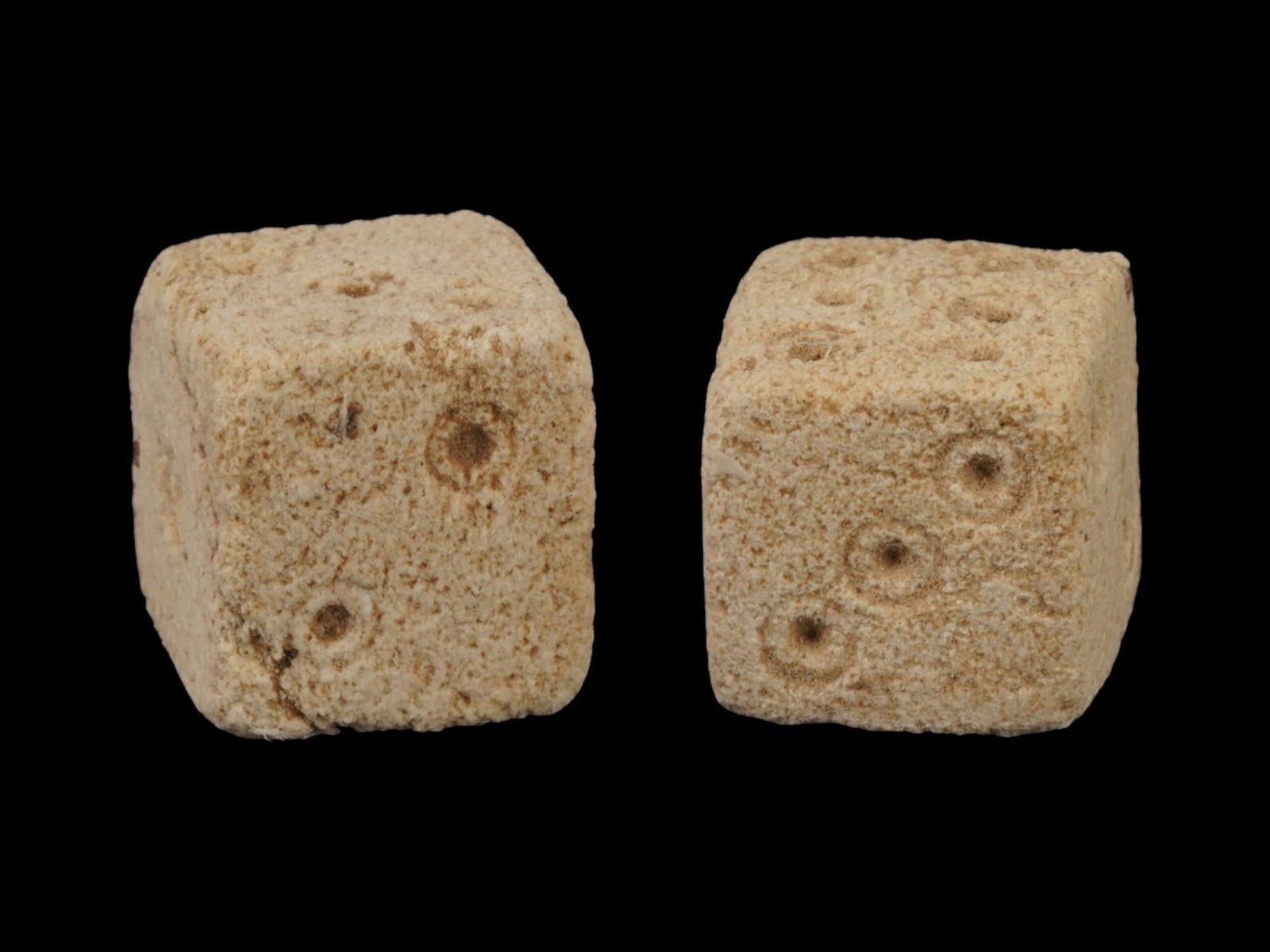 PAIR OF ANCIENT ROMAN STONE DICE 100 TO 300 AD: A pair of ancient Roman carved stone gaming dice. Imperial Rome era, circa 100 to 300 AD. Square shape. Archaeological Finds And Relics, Stone Carvings, and Collectibles. THIS LOT IS ELIGIBLE FOR A 30