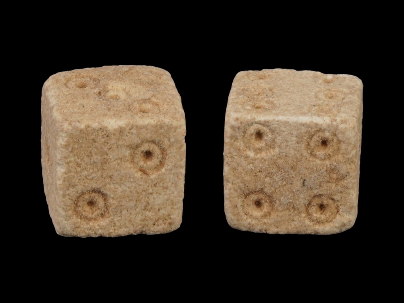 PAIR OF ANCIENT ROMAN STONE DICE 100 TO 300 AD: A pair of ancient Roman carved stone gaming dice. Imperial Rome era, circa 100 to 300 AD. Square shape. Archaeological Finds And Relics, Stone Carvings, and Collectibles. THIS LOT IS ELIGIBLE FOR A 30