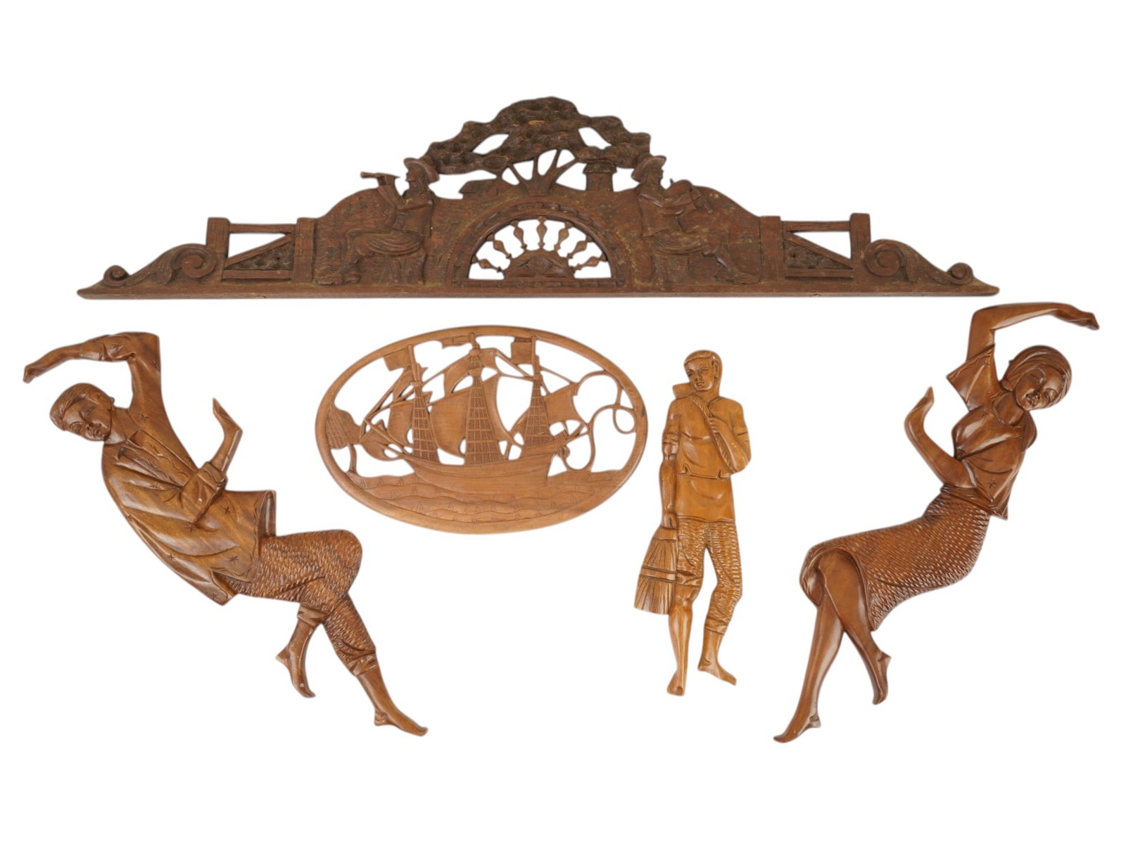 LOT OF VINTAGE CARVED WOODEN FIGURAL WALL PLAQUES: A lot of five vintage hand-carved wooden wall plaques, presumably of European origin. Nautical door pediment. Sailing ship. Peasant boy. A pair of matching male and female figures. Collectible Folk Ar