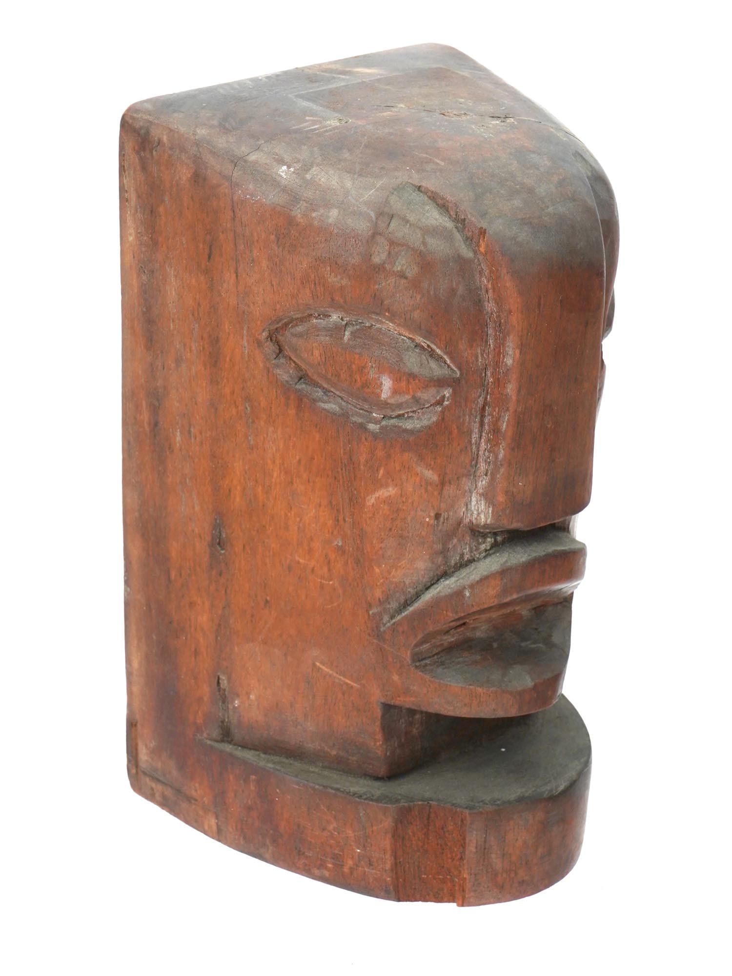 VINTAGE HAND CARVED WOODEN HEAD FIGURE: A vintage hand carved wooden head figure. Possibly of South American origin. The head shows large facial features with a large nose and eyes, and an open mouth. Can be floor mounted or wall hung. Trad