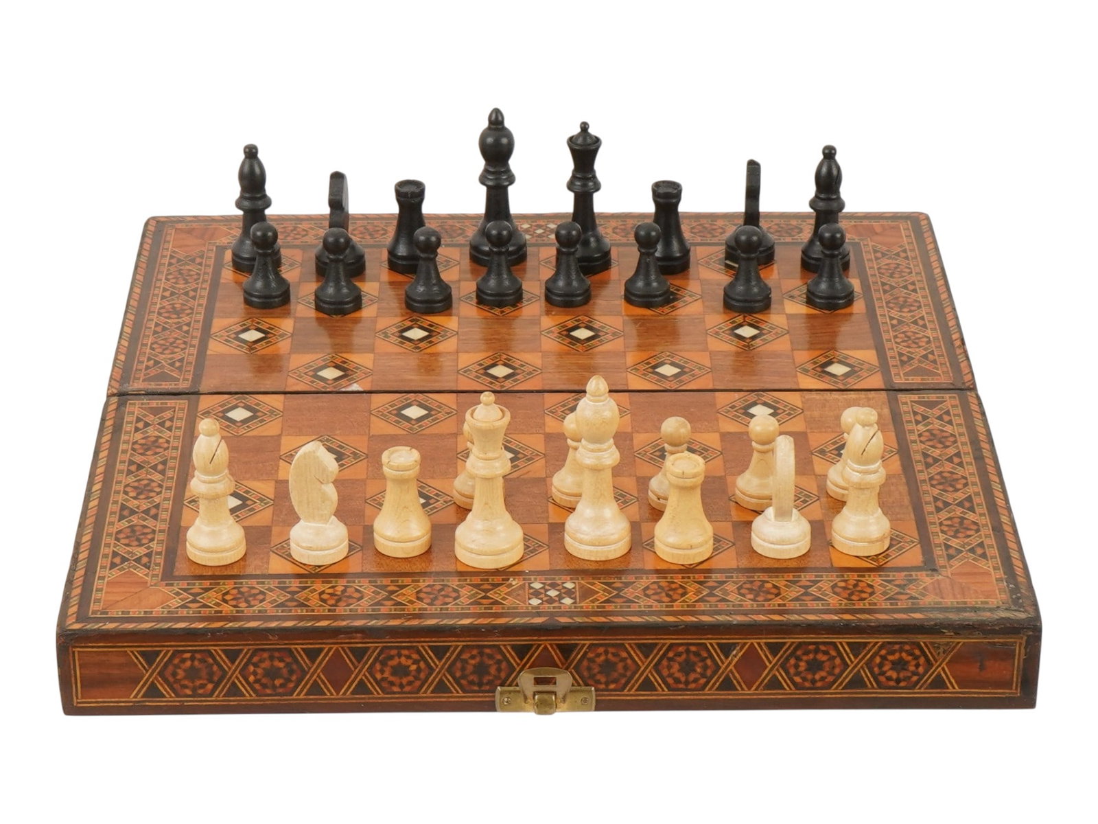 VINTAGE MOTHER OF PEARL INLAY AND WOOD GAME BOARD: A vintage folding game board is constructed from wood and features intricate geometric marquetry accented with mother-of-pearl inlays. The exterior serves as a chessboard, while the interior opens to 