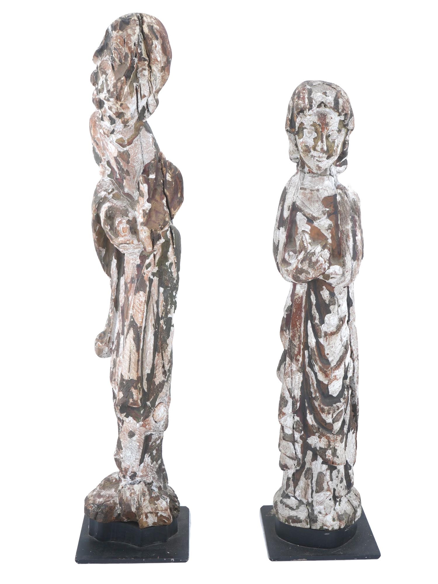 ANTIQUE CHINESE PAIR WOODEN SCULPTURES CA 19TH C: An antique large Chinese pair of wooden sculptures. Two hand carved and painted figures of a man and a woman in long robes that completely cover the body and in prayer poses. Mounted on a square stand