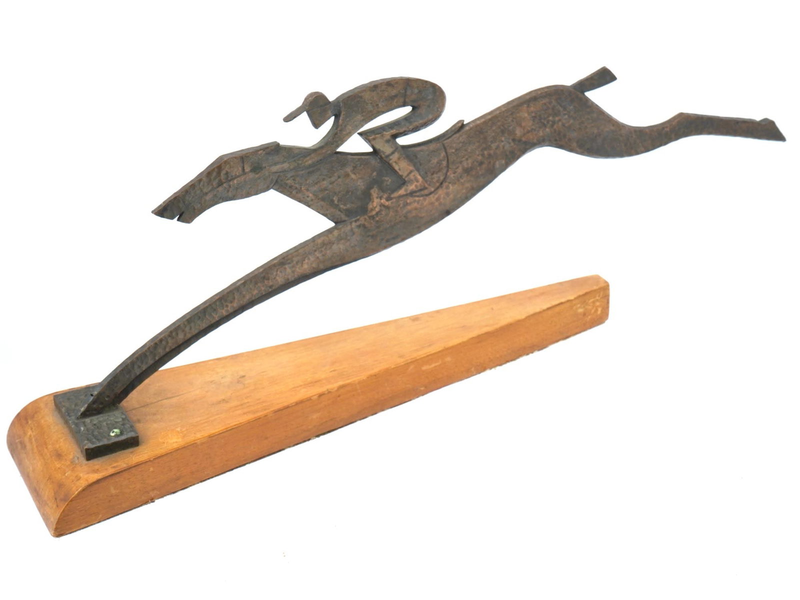 VINTAGE METAL DYNAMIC EQUESTRIAN SCULPTURE: A vintage metal equestrian sculpture on a stand. Circa the late 20th century. Modernist extremely dynamic equestrian artwork depicts a rider on a fast galloping horse. Mounted on a wooden triangular s