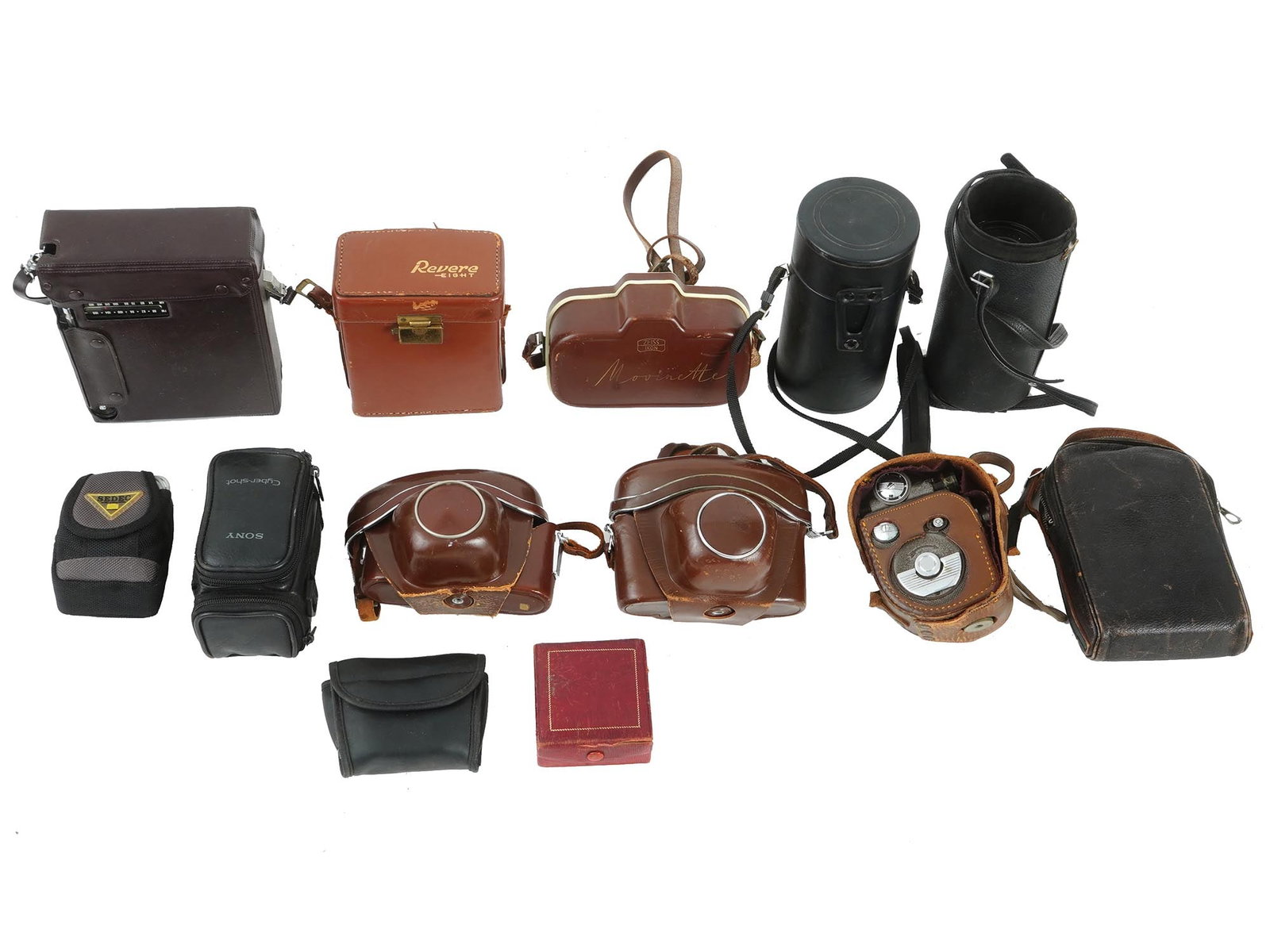 VINTAGE CAMERAS AND CINE-KODAK EIGHT VIDEO CAMERA: A group of vintage cameras, stored in bags, including models from Contaflex, Sony, Movinette, and Revere, along with a Cine-Kodak Eight video camera. This assortment represents a mix of classic photog