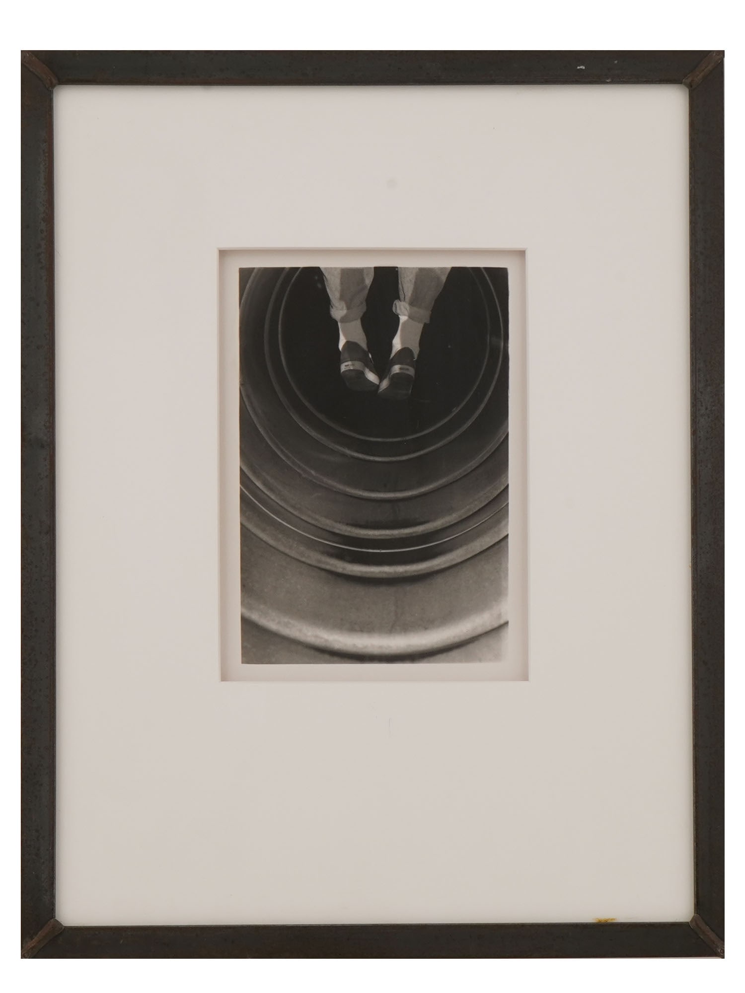 SURREALIST PHOTO COLLAGE SIGNED TONY 1989: Monochrome photo collage on paper. The artwork depicts a pair of legs hanging over the abyss. Mix of Constructivist and Surrealist styles. Signed Tony and dated 1989 on the backside. Matted and framed