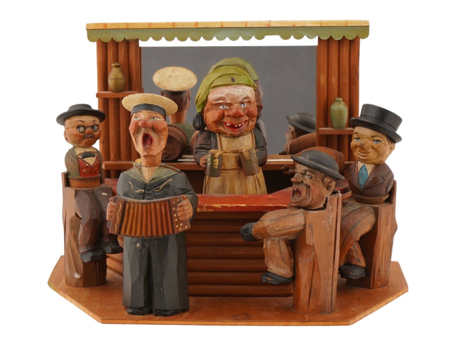 1952 ANRI ITALIAN HAND CARVED WOOD BAR SCENE MUSIC BOX: A vintage music box by ANRI. Designed as a bar counter with hand-carved and painted wooden figurines of visitors. Titled Signorina di Parigi. Label dated 1952 on the backside. ANRI is an Italian