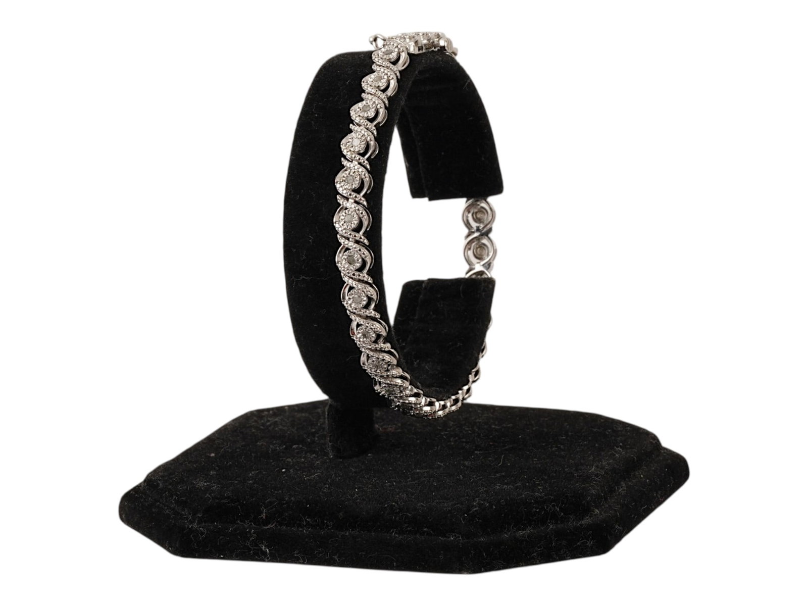 ELEGANT STERLING SILVER BRACELET W CUBIC ZIRCONIA: An elegant sterling silver bracelet featuring a twisted design and set with cubic zirconia. Hallmarked with 925 sterling silver standard on the clasp. Jewelry, Gifts, and Accessories. Total weight: 10