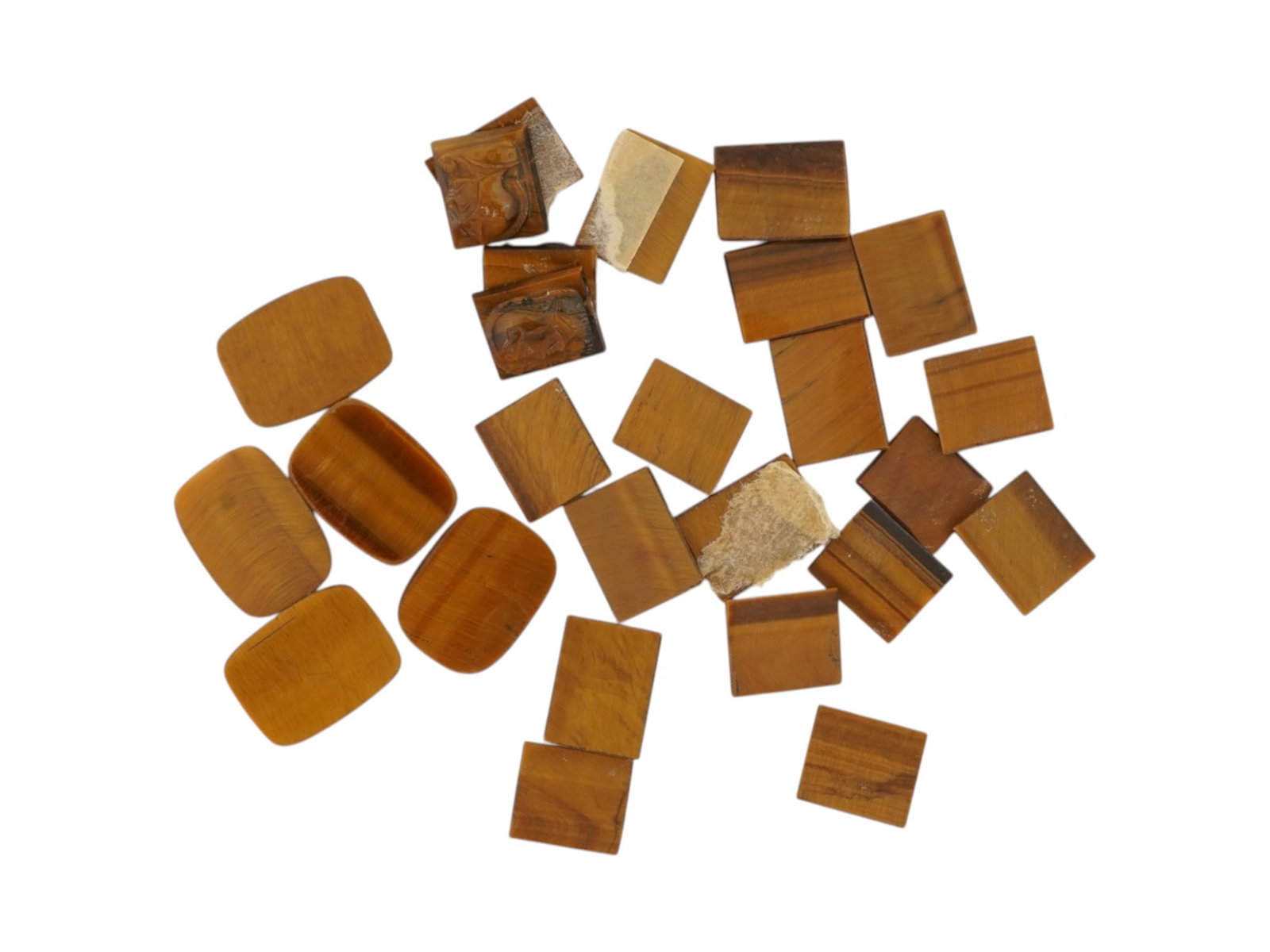 COLLECTION OF PORTRAIT CARVED TIGERS EYE CAMEOS: A collection of hand carved tigers eye cameos. A total of 25 items. Each piece features a knight profile portrait rendered in high relief. Rectangular shape. Collectible Jewelry And Glyptic Art, Sculp