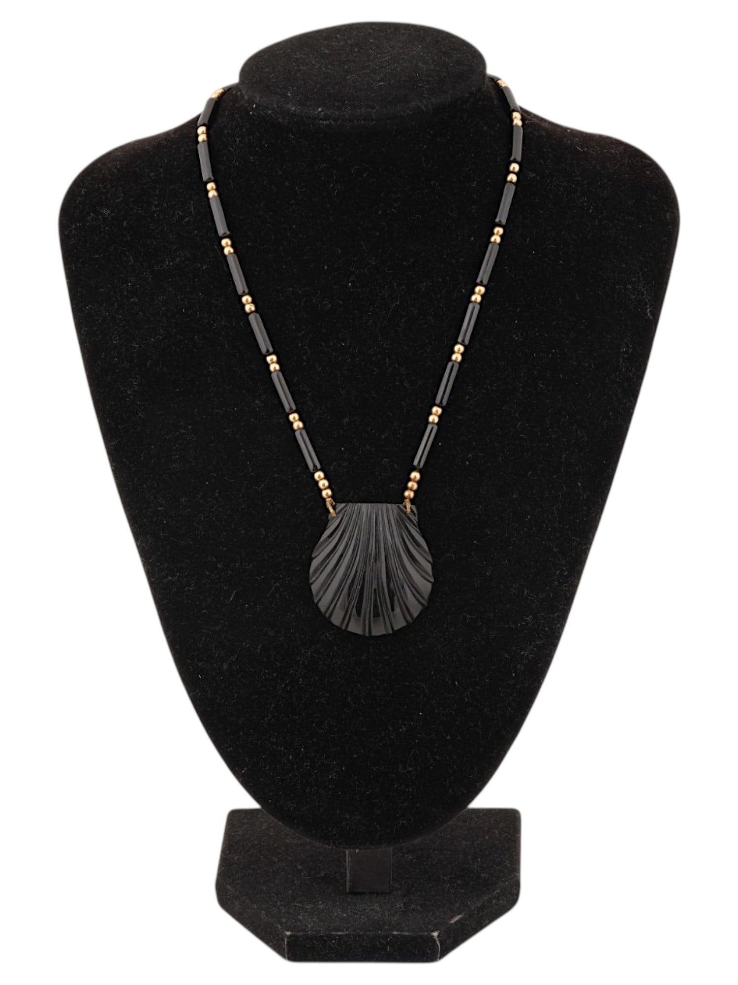 VINTAGE BLACK CORAL AND GOLD BEADED SHELL NECKLACE: A vintage necklace composed of black coral beads and gold fitting beads, as well as a large seashell-shaped pendant. Total Weight: 23.30 g. Mineral Stone Jewelry And Fashion Accessories. THIS LOT IS E