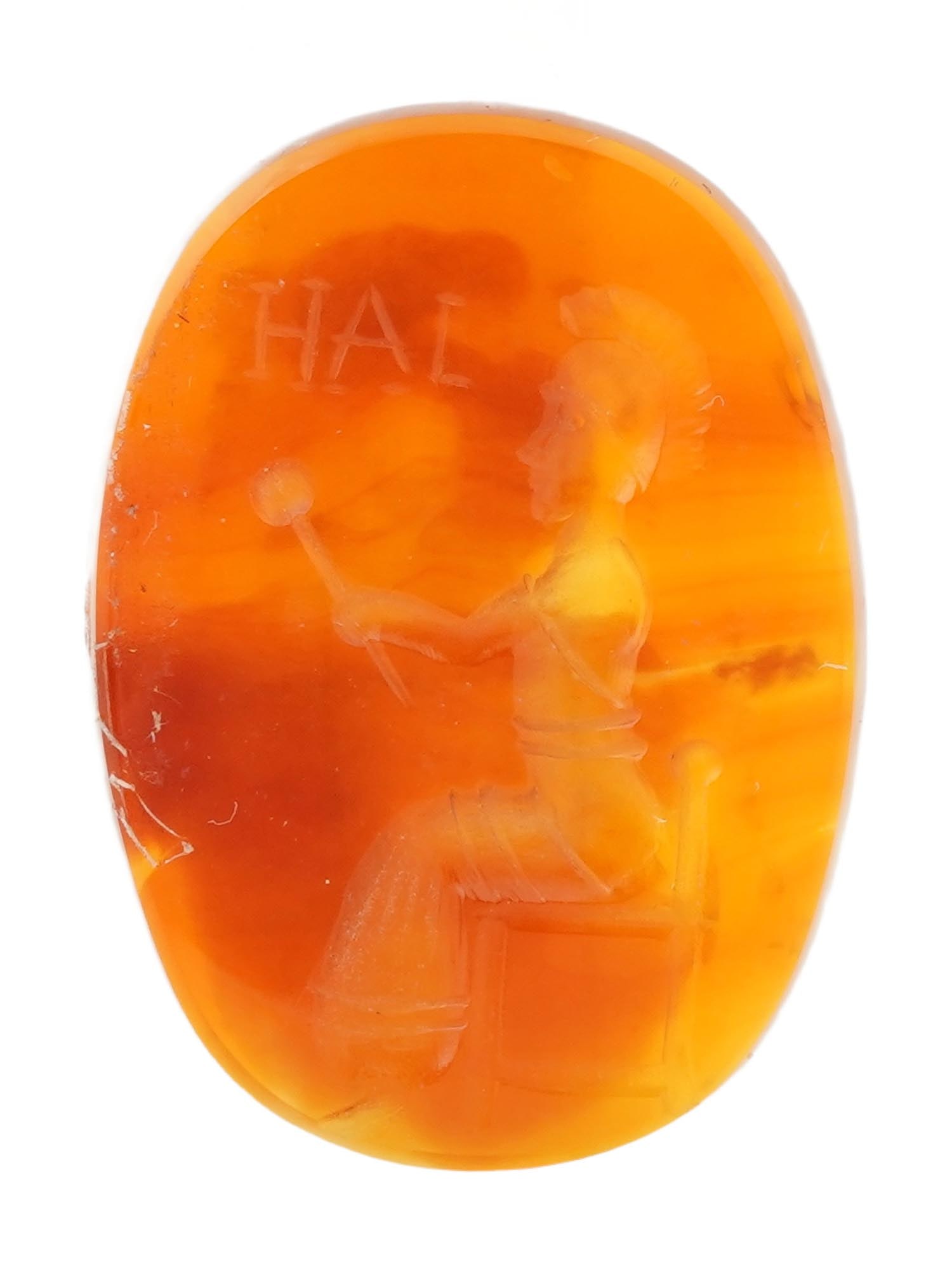 ANTIQUE VICTORIAN CARNELAIN INTAGLIO SEAL: An antique late 19th-century carnelain intaglio seal. Oval shape. The intaglio depicts a seated goddess. Victorian Collectibles, Mineral Stone Carvings, Stamps And Seals. THIS LOT IS ELIGIBLE FOR A 30