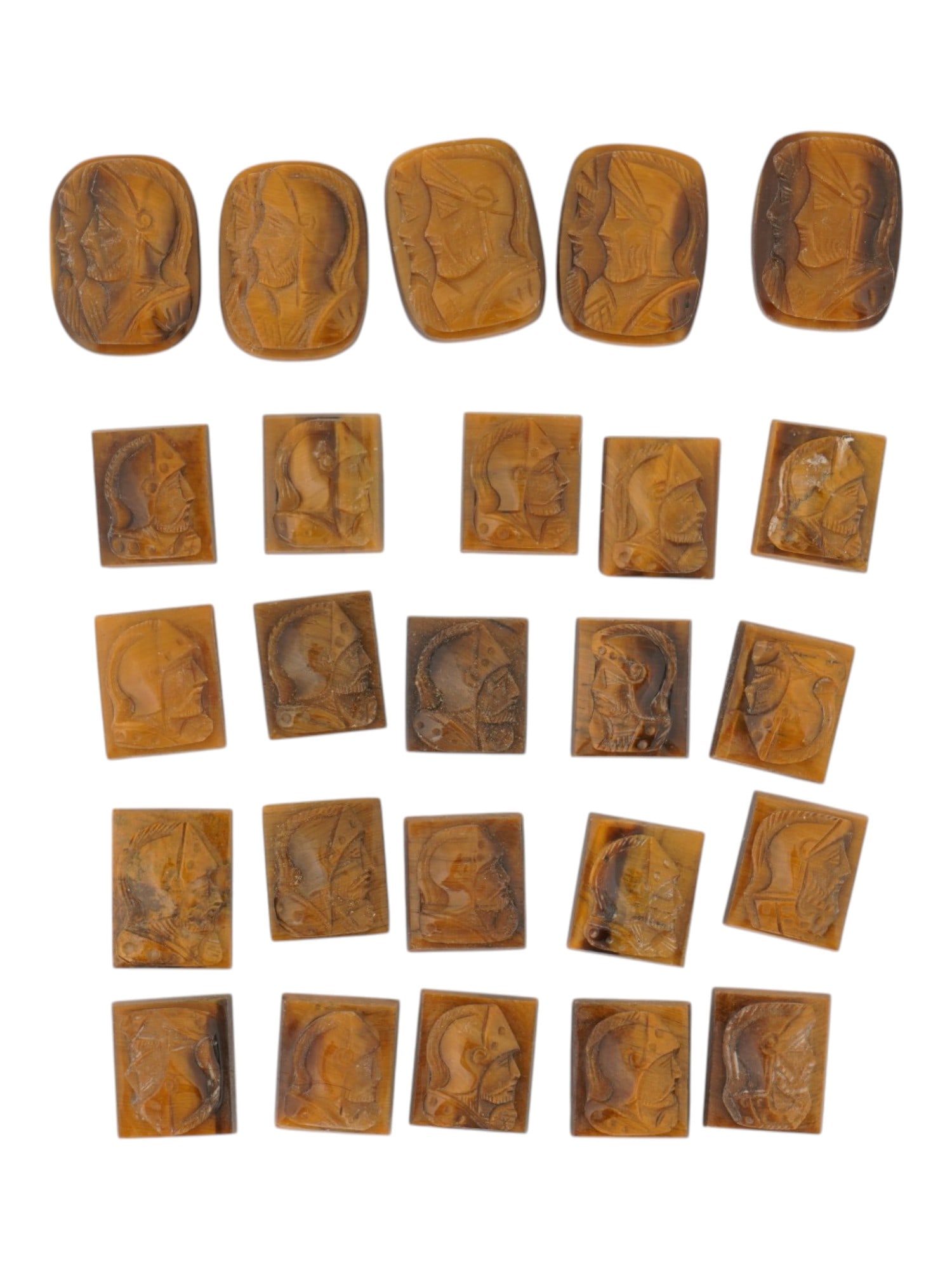 LOT OF WARRIORS PORTRAITS CARVED TIGER EYE CAMEOS: A collection of twenty five vintage cameos in various shapes. Each cameo with a rectangular or oval hand carved Tiger eye panel with relief portrait of a Roman warrior in profile. Vintage Jewelry And