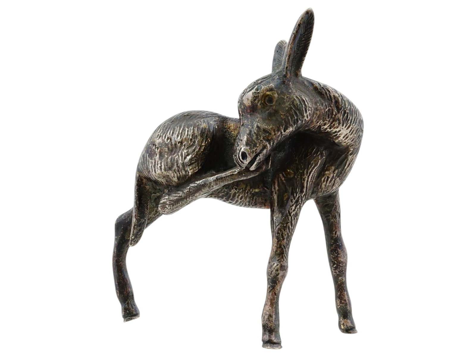 VINTAGE HANDCRAFTED SILVER DONKEY FIGURINE: A vintage handcrafted silver donkey figurine. The finely detailed figurine is made in the shape of a realistic standing donkey engraved with detailed patterns. Unmarked. Silverware, Figures, Figurines