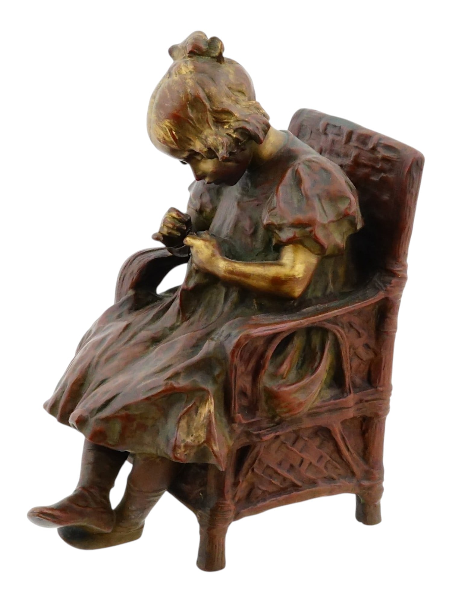 LEON ALEXANDRE BLANCHOT FRENCH BRONZE SCULPTURE: Leon Alexandre Blanchot, French, 1868 to 1947, cast bronze figurine of a girl sitting in a wicker chair. Gilding and brown patina. Signed on the bottom. Undated, ca. 1910s. Collectible Sculpture And F