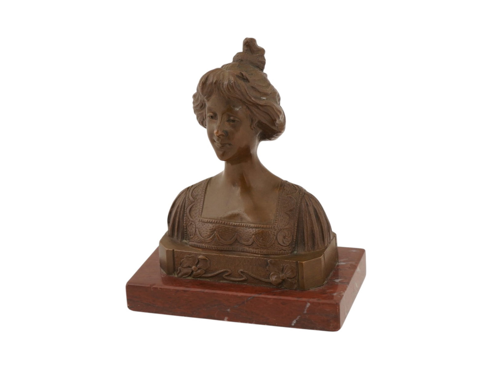 ANTIQUE ART NOUVEAU BRONZE BUST OF A YOUNG WOMAN: An antique Art Nouveau bronze portrait bust of a young woman, dating to the late 19th or early 20th century. The figure is modeled with a refined expression, an elaborate coiffure, and period attire a