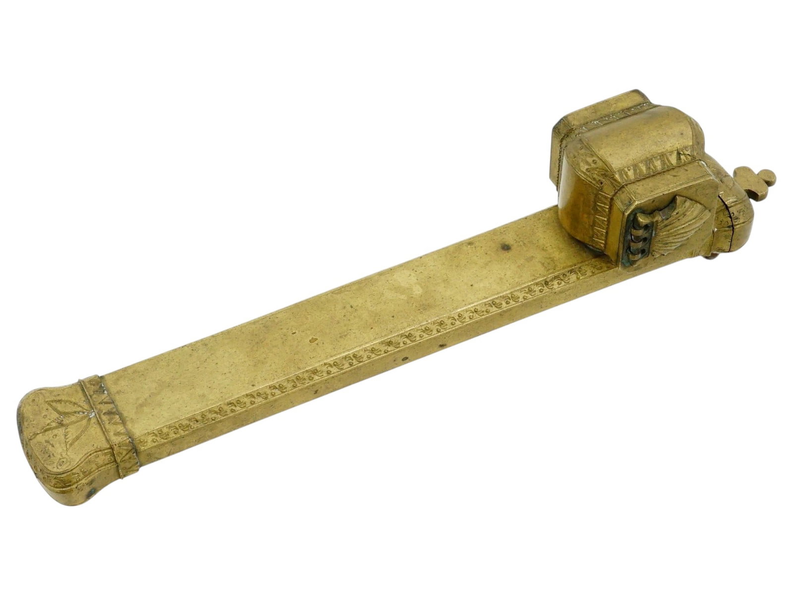 ANTIQUE OTTOMAN TURKISH BRASS QALAMDAN WITH INKWELL: An antique Turkish brass qalamdan, or pen box, with an attached inkwell. Ottoman Empire, 19th century. Traditional oblong narrow deep box with hinged lid on the side. Etched floral decor. The inkwell 