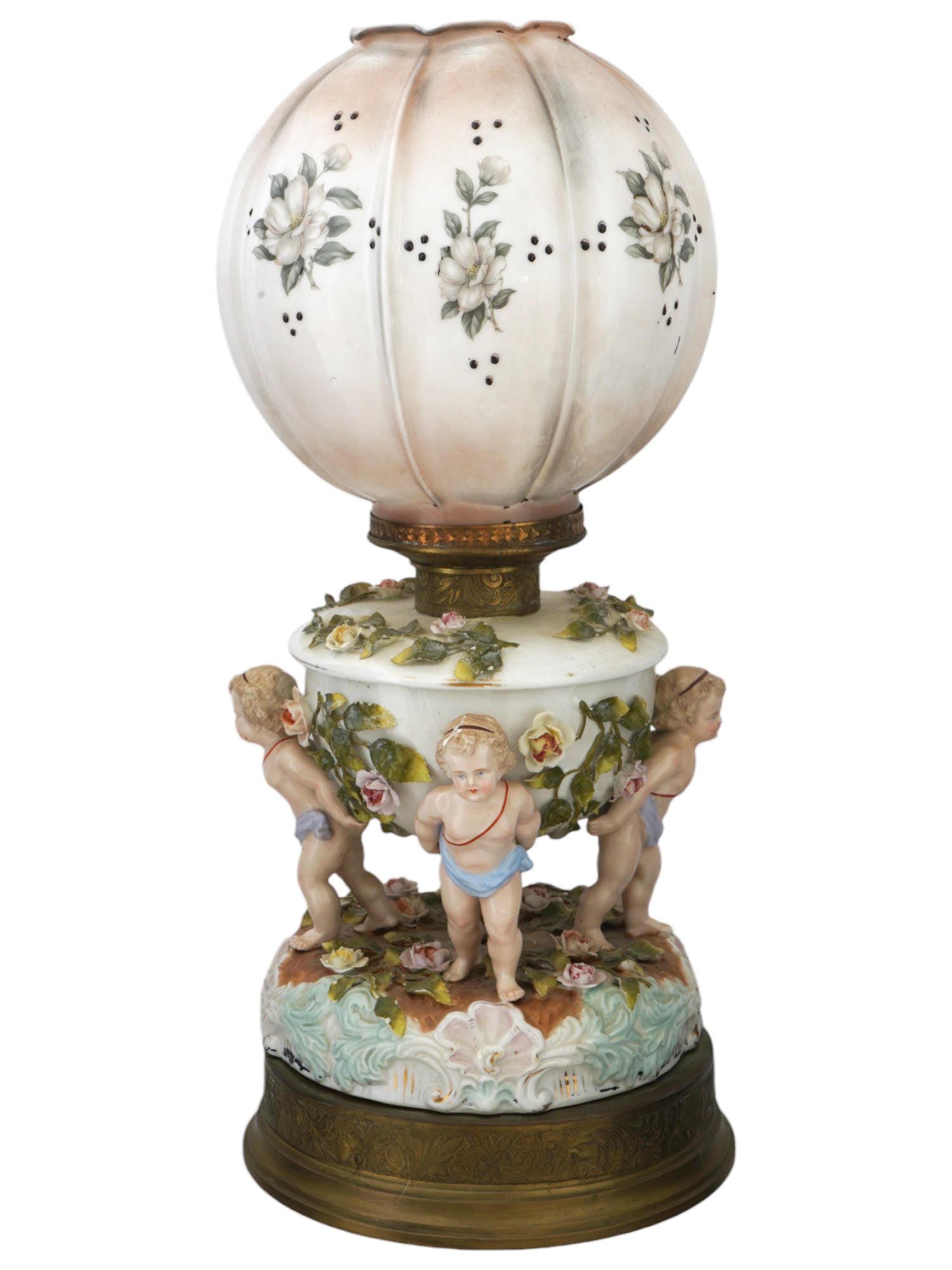 ANTIQUE 19TH C GERMAN PORCELAIN ELECTRIC LAMP: A fine antique 19th century Meissen type porcelain lamp, the base is modeled as a white porcelain globular form vase interviewed with beautifully detailed flowers and supported by three polychrome han