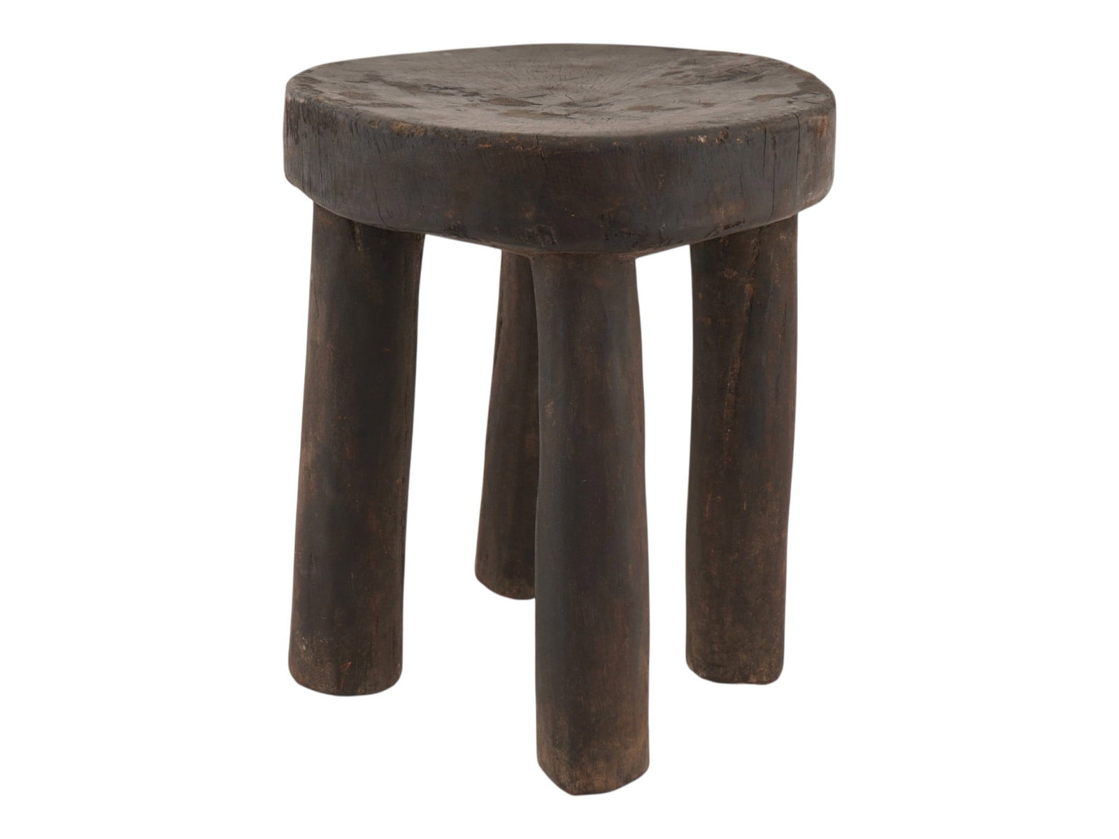 AFRICAN WOOD SENUFO MILKING STOOL FROM IVORY COAST: A West African stool, often called a Senufo milking stool from Ivory Coast. These stools are traditionally hand carved from a single piece of wood. They are distinguished by their sturdy, simple desig