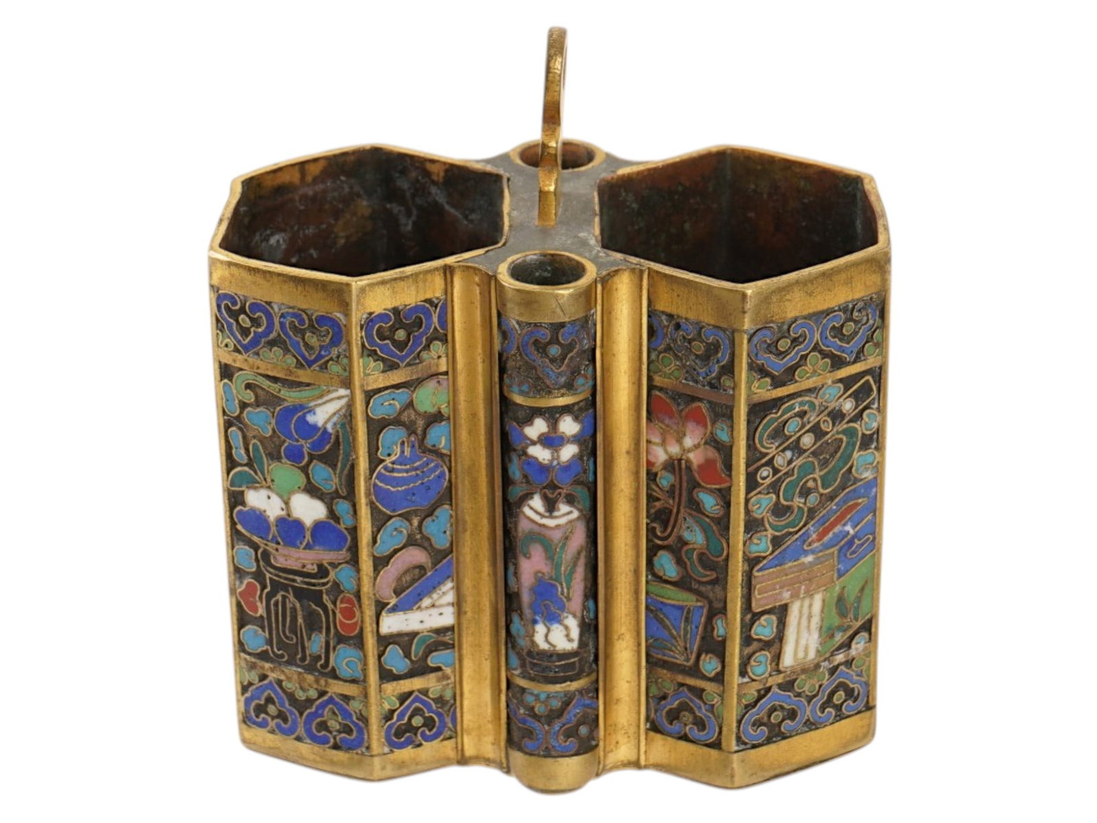 ANTIQUE CHINESE QING CLOISONNE ENAMEL OPIUM BOX: An antique Chinese opium box dating from the Qing Dynasty. The item is crafted from copper using the cloisonne enamel technique. It has a distinctive multifaceted shape and is decorated with polychrom