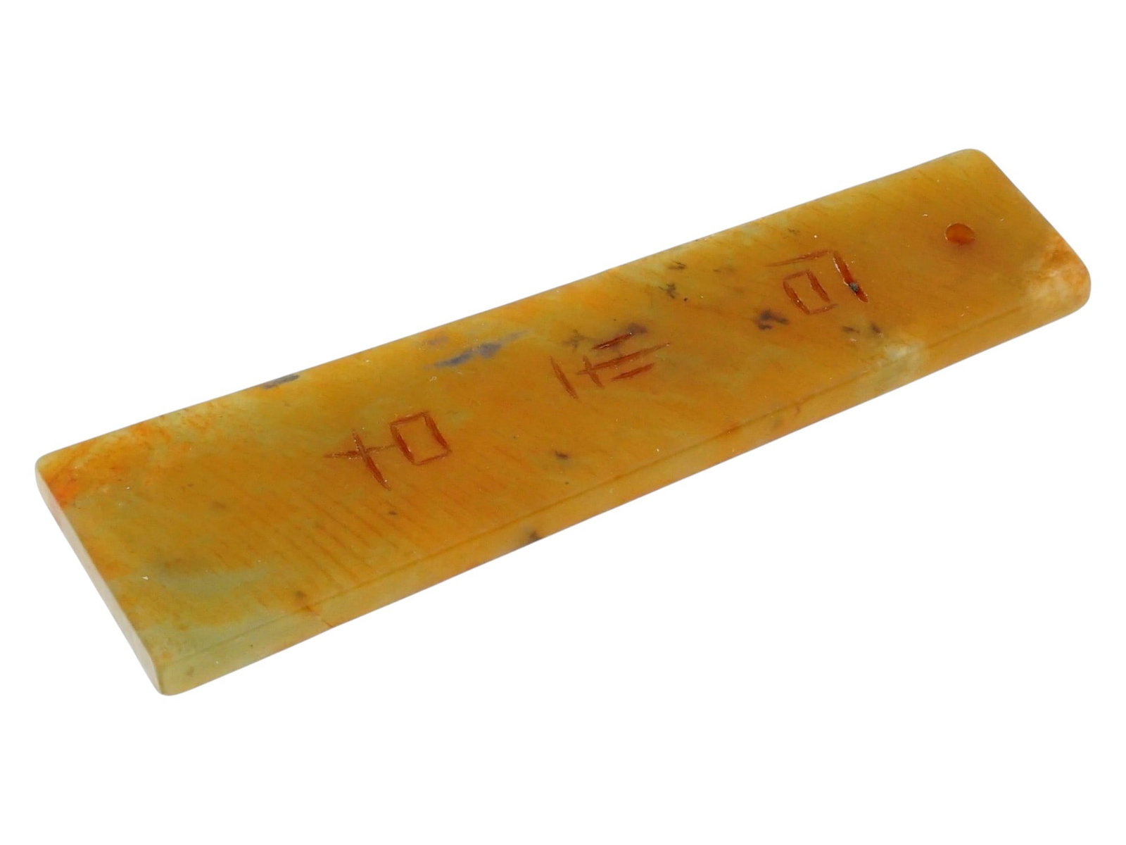 CHINESE ARCHAISTIC RUSSET JADE INSCRIBED PENDANT PLAQUE: A Chinese archaistic jade pendant plaque styled after ancient ritual blades or tablets. The piece is fashioned from a variegated celadon-green jade heavily dominated by fiery orange and green mottled 