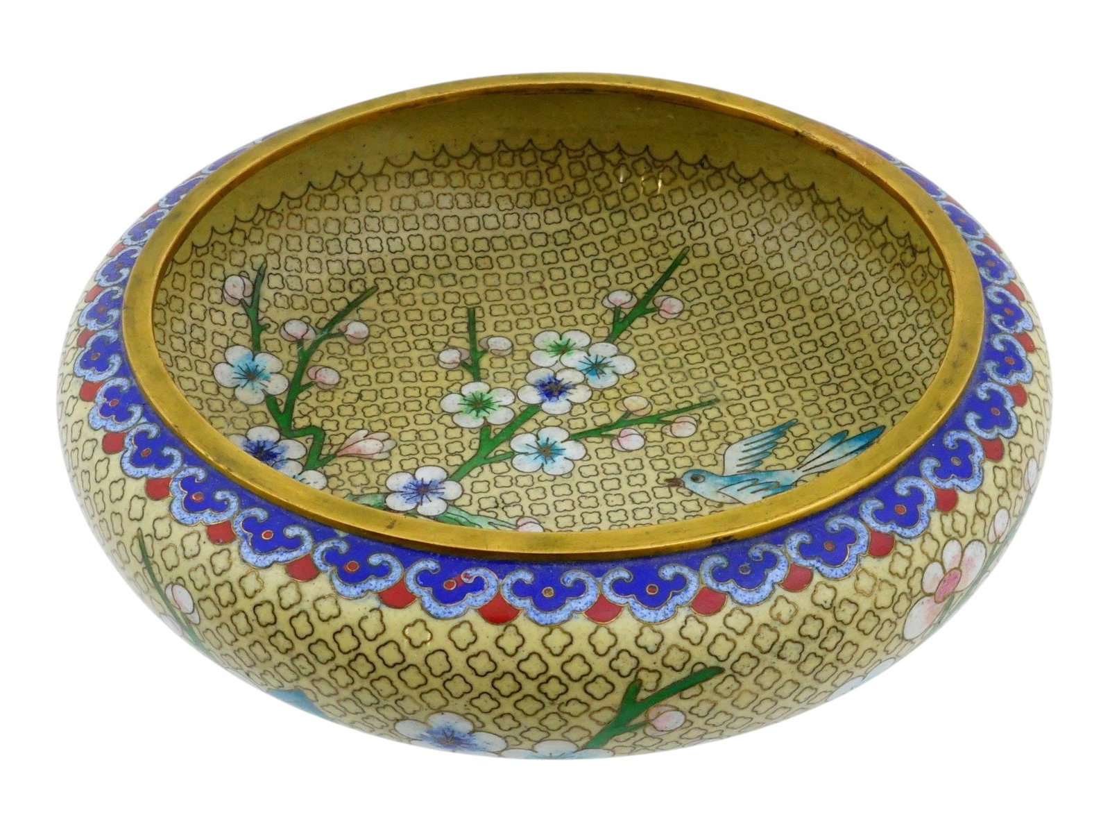 ANTIQUE CHINESE CLOISONNE ENAMEL FLOWER BOWL: An antique Chinese brass serving bowl with cloisonne enamel design. Circa early to mid 20th century. Squat round shape, pronounced foot. The piece is decorated with a flower motif on both exterior and