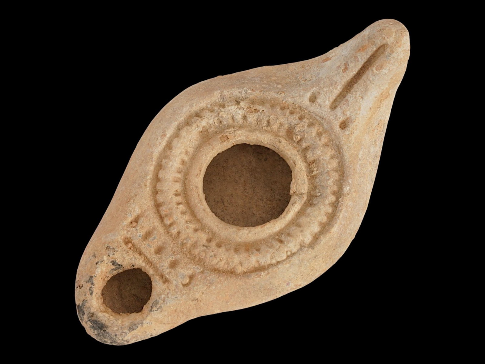 ANCIENT JUDAICA MENORAH OIL LAMP TERRACOTTA 200-400 AD: An ancient Holy Land Judaica terracotta oil lamp dating from the 2nd to 4th century AD, decorated with the menorah motif on the spout, symbolizing its connection to Jewish religious tradition and heri