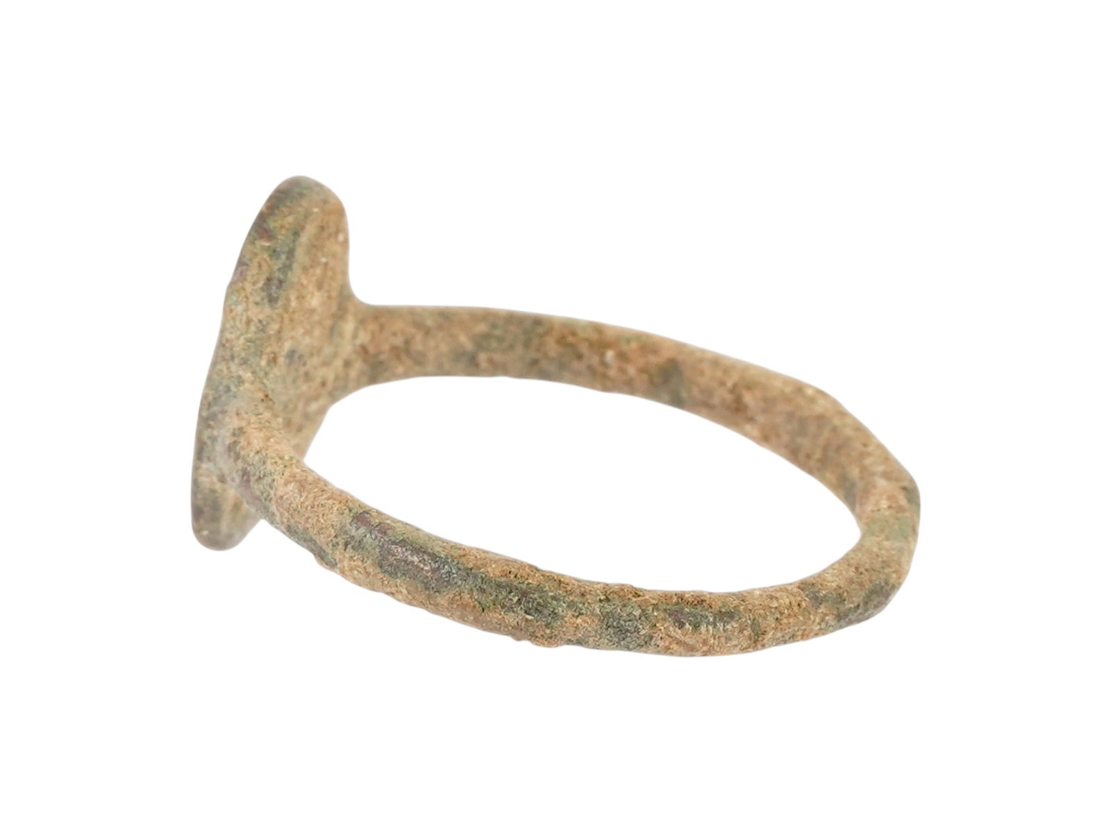 ANCIENT BYZANTINE BRONZE SIGNET RING 400 TO 600 AD: An ancient Byzantine cast bronze signet ring, dating from approximately 400 to 600 AD, features an oval bezel deeply incised with blessing inscriptions. Typical of the Early Byzantine period, such rin