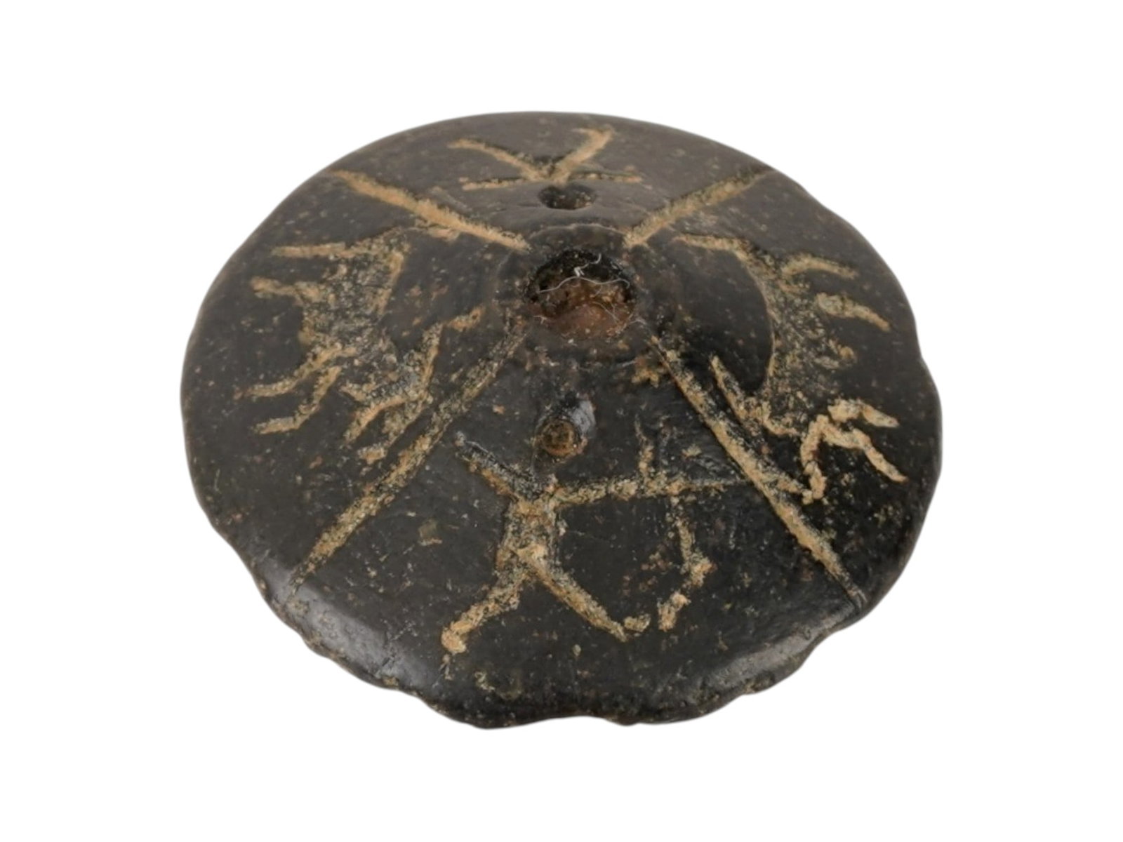ANCIENT EGYPTIAN LATE PERIOD STEATITE SPINDLE WHORL: An ancient Egyptian steatite spindle whorl dating to the Late Period, circa 500 to 200 BC. This tool served as a weight in the spinning of thread, reflecting the essential role of textile production i