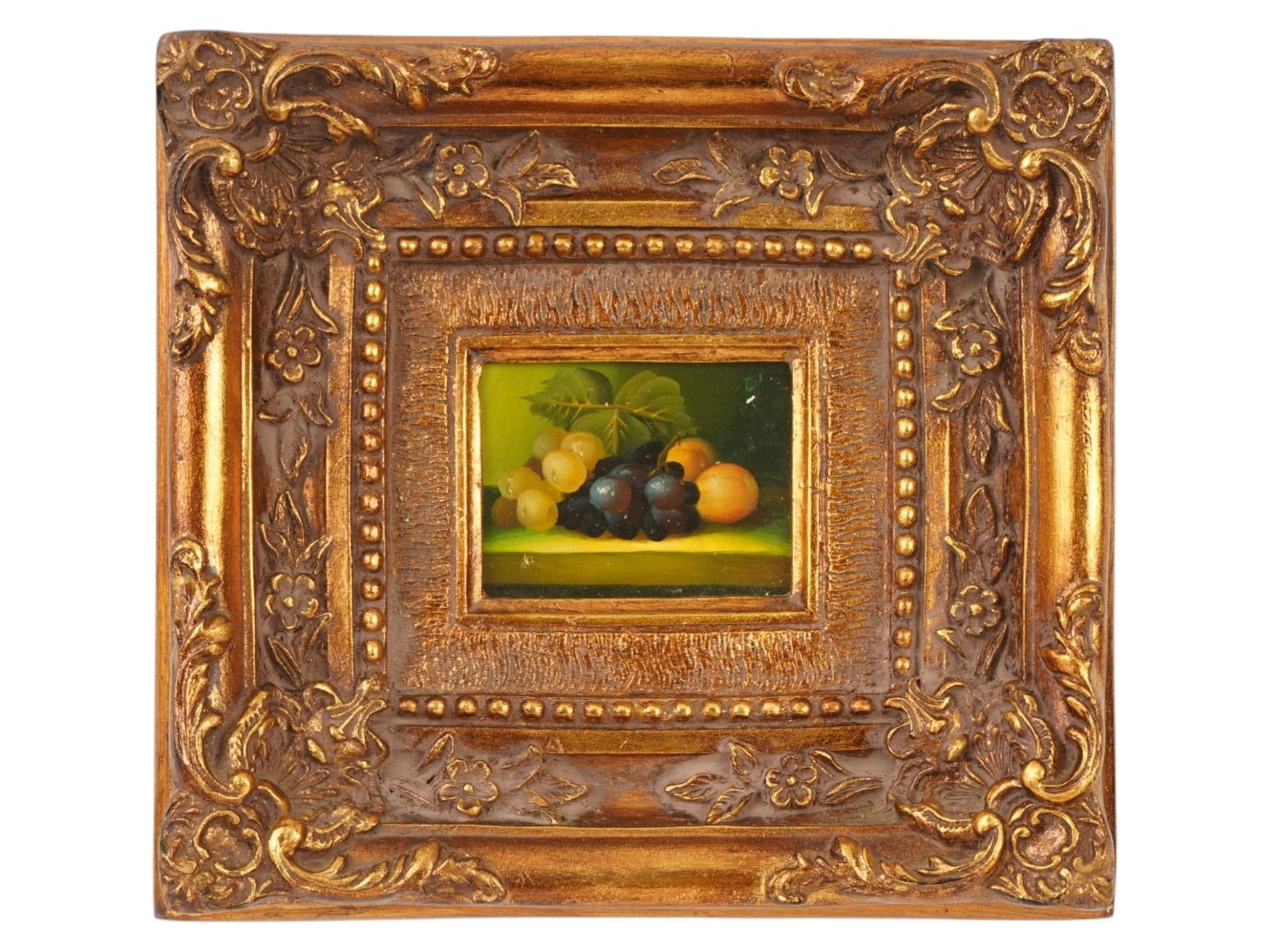 MINIATURE VINTAGE OIL STILL LIFE PAINTING W GRAPE: A miniature vintage oil on print on board still life painting. The painting depicts a classic still life with bunches of grapes and apricots set against a dark, atmospheric background with subtle gree