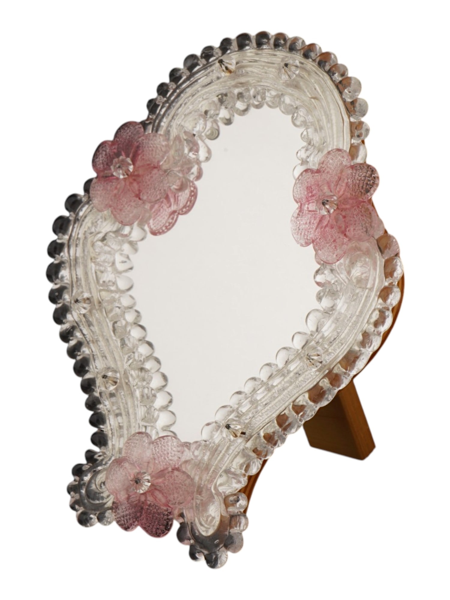 VINTAGE 1960S VENETIAN MURANO GLASS TABLE MIRROR: A vintage 1960s Venetian Murano glass table mirror. The mirror features three pink glass flowers and a unique wooden stand. Vintage Italian Vanity Mirrors And Glass Decor Collectibles. THIS LOT IS ELI