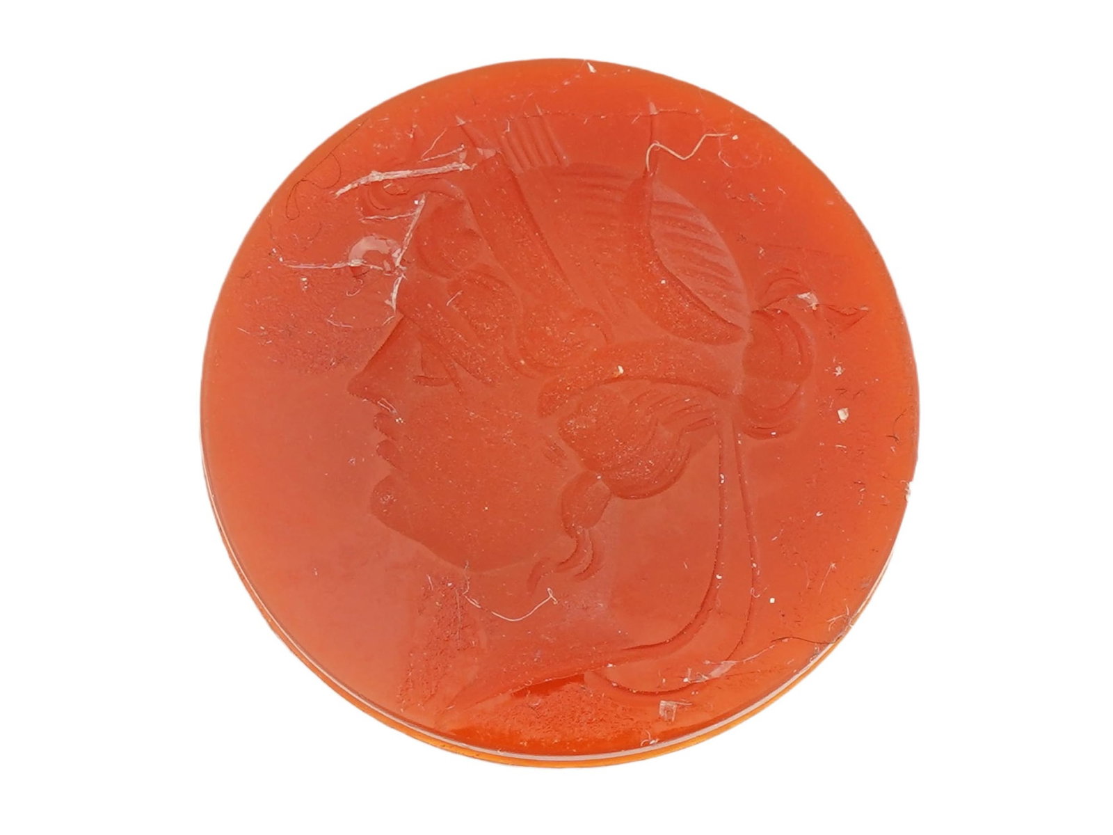 ROMAN MANNER HAND CARVED CARNELIAN STONE INTAGLIO: A hand carved Carnelian stone Intaglio depicting a profile portrait in the ancient Roman manner. Circular in shape. The reverse side is flat. Antique and Vintage Jewelry Wares and Accessories, and Col