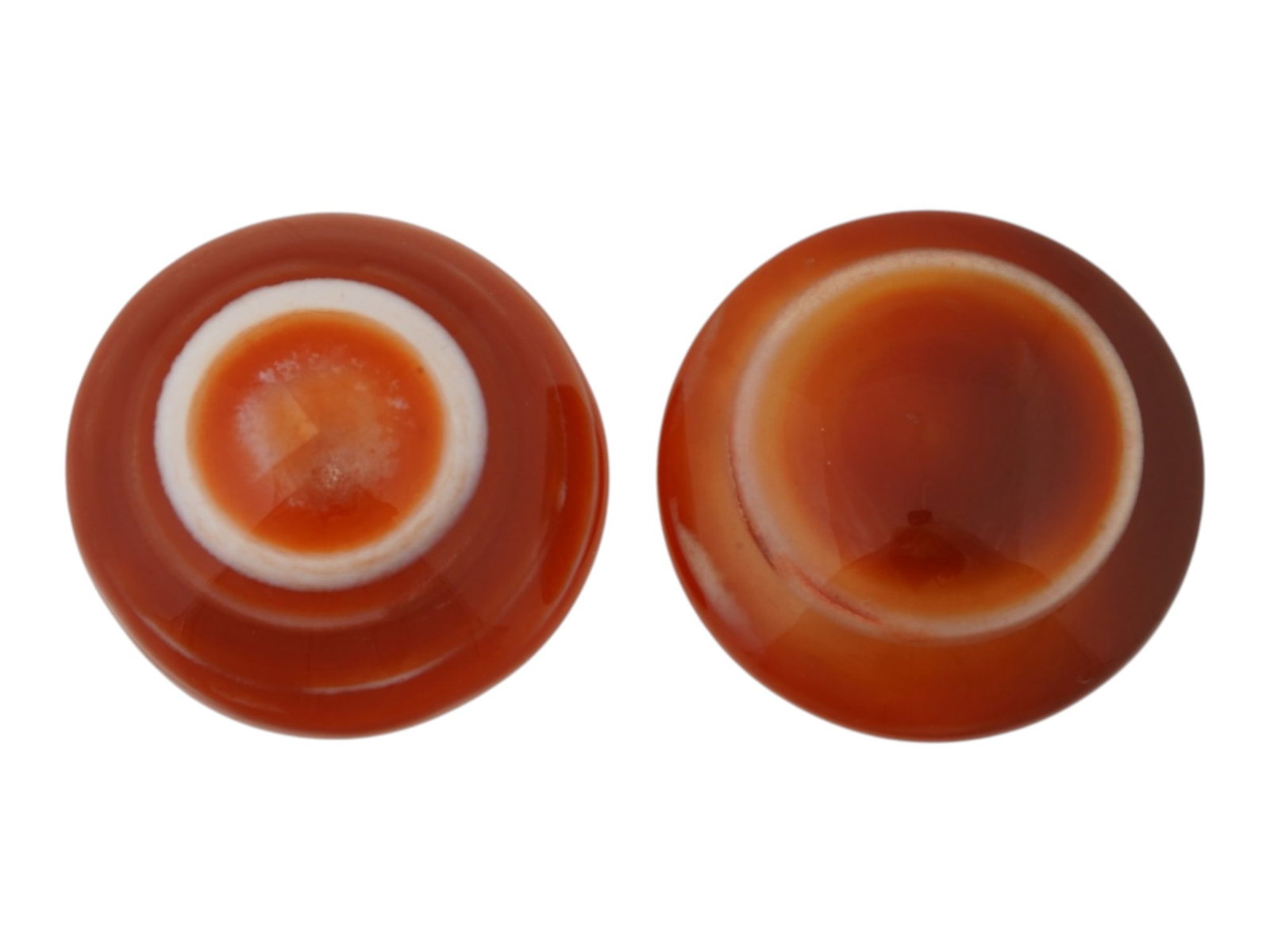 PAIR OF LARGE NATURAL SARDONYX BANDED AGATE CABOCHON: A pair of large natural sardonyx banded agate cabochons. The polished gemstones display rich translucent layers of orange, reddish-brown, and white. Natural Gemstones And Jewelry Collectibles. THIS LO