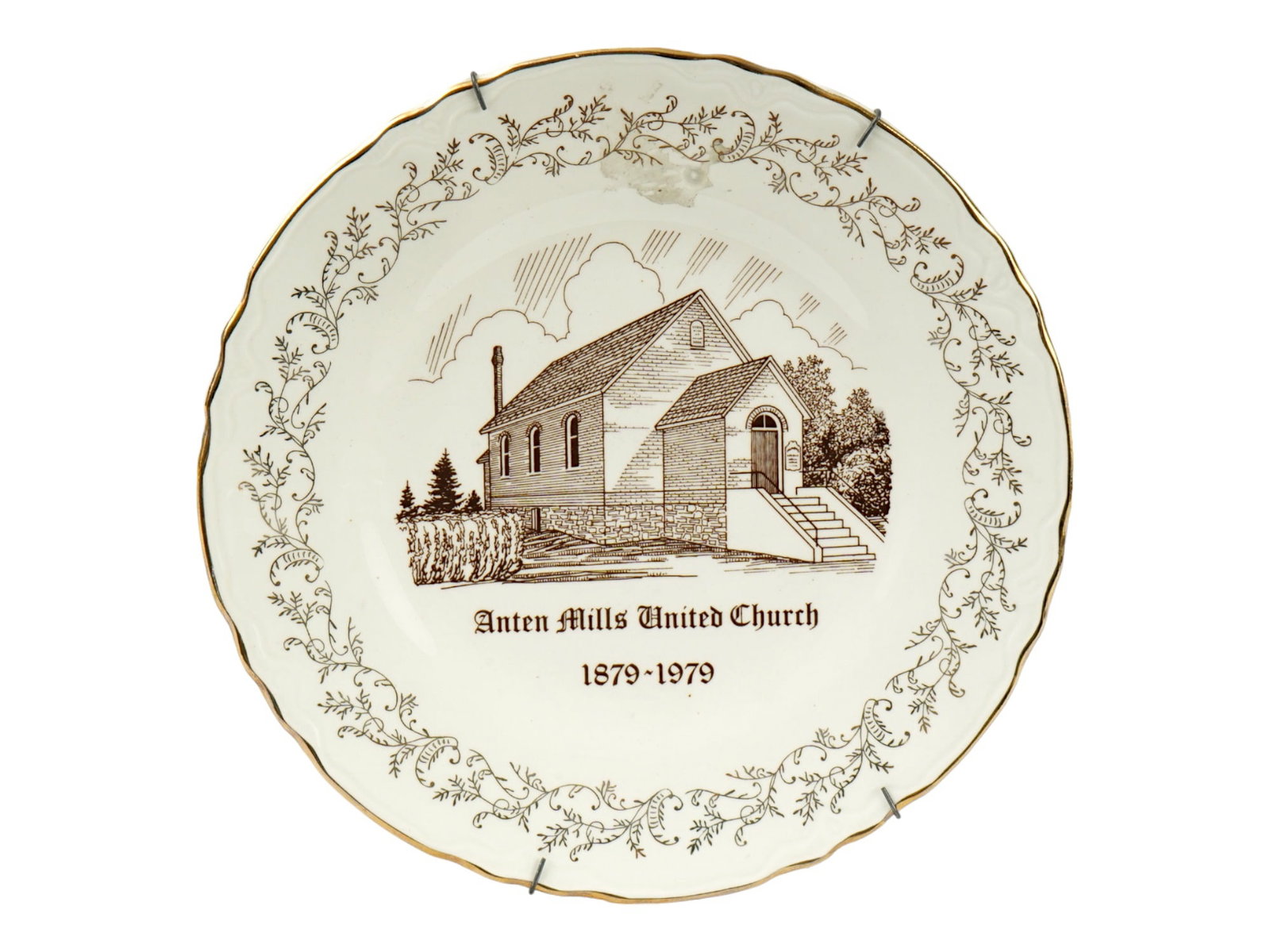 CANADIAN UNITED CHURCH CENTENARY PORCELAIN PLATE: A vintage Canadian porcelain cabinet plate. A comemmorative wall plate dedicated to the 100th anniversary of the Anten Mills United Church foundation. The piece is decorated with a church view, title,
