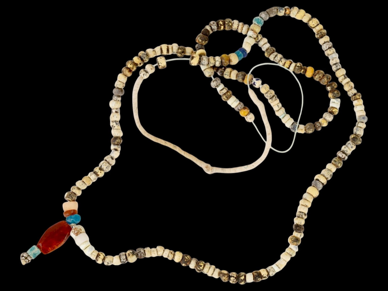 ANCIENT ROMAN GLASS STONE BEAD NECKLACE 100 TO 300 AD: An ancient Roman beaded necklace dating from 100 to 300 AD. The necklace showcases a range of bead colors, mostly circular shaped, reflecting the Roman eras intricate glasswork and appreciation for vi