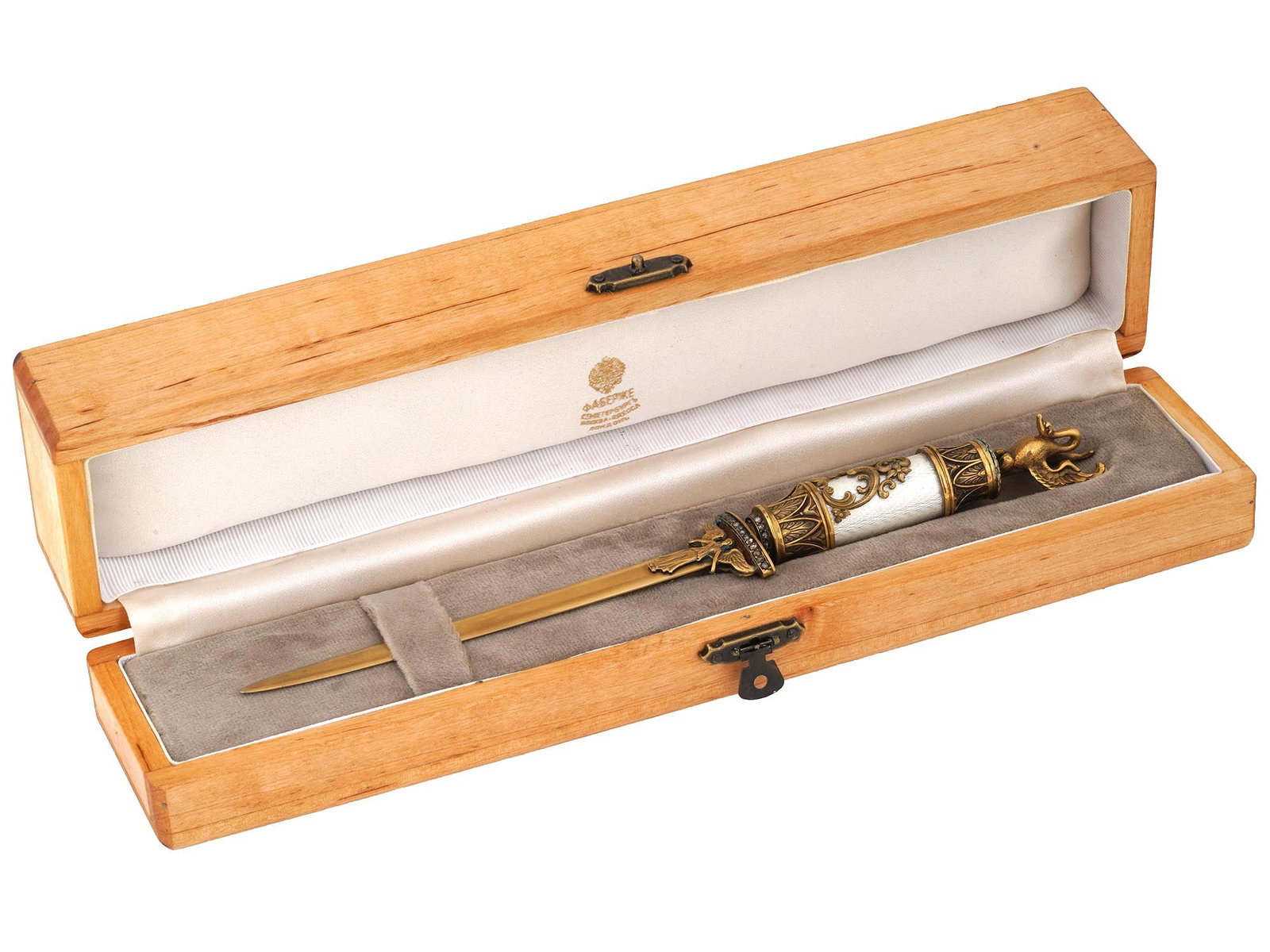 RUSSIAN GILT SILVER ENAMEL DIAMONDS LETTER OPENER IOB: A Russian gilt silver letter opener knife decorated with winged figure to both sides and a gilt silver mounted white guilloche enameled handle embellished with the scroll pattern. Surmounted with a si