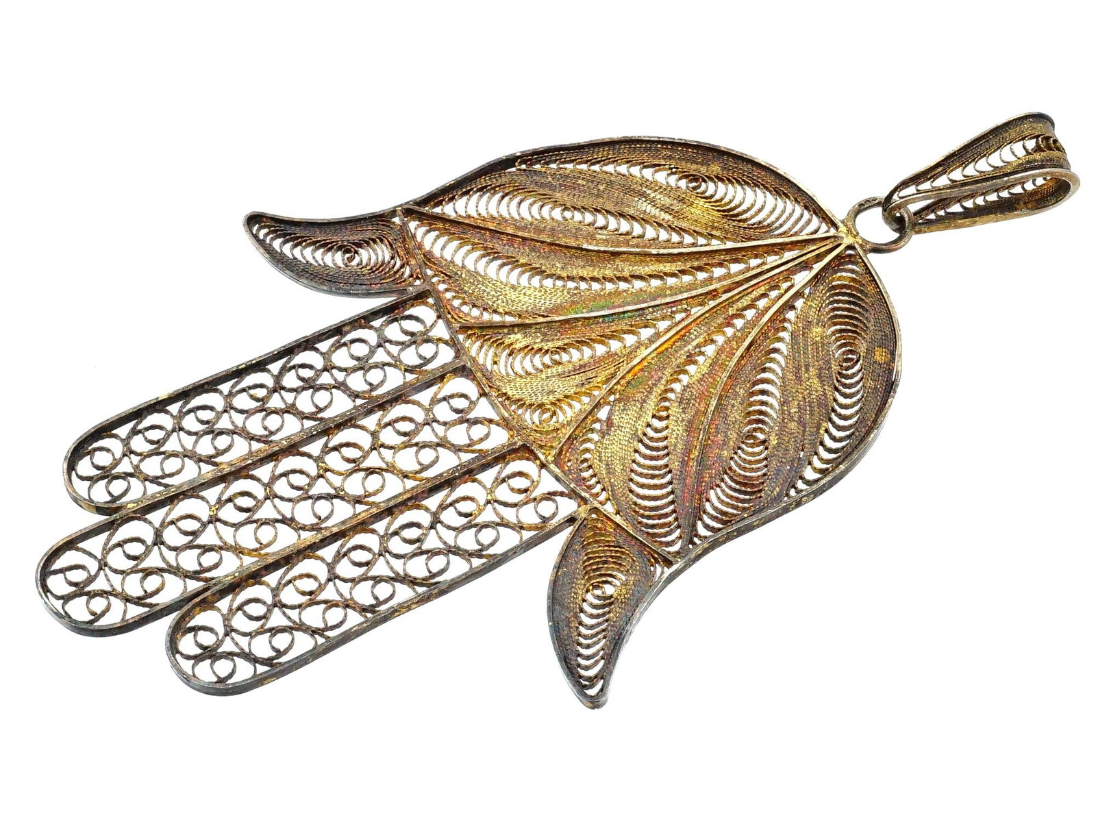 MIDDLE EASTERN HAMSA HAND OF FATIMA SILVER PENDANT: A vintage Silver Hamsa figural pendant, also known as the Hand of Fatima, featuring a dual textured design combining repousse and filigree techniques. The upper portion of the hand is decorated with a