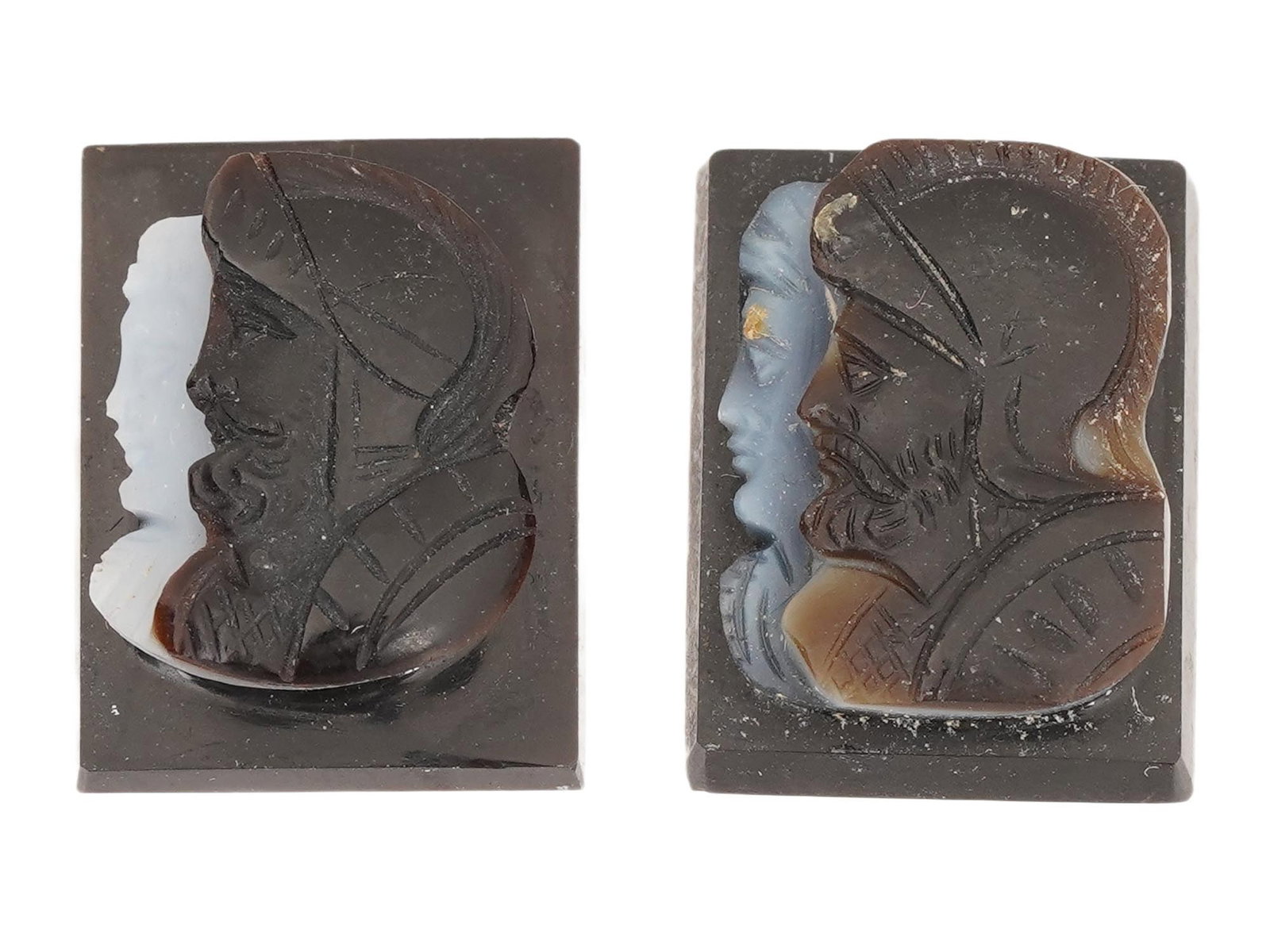 PAIR OF VINTAGE HAND CARVED ONYX CAMEOS: A pair of vintage hand-carved onyx cameos of rectangular shape. Double profile portrait of Roman soldiers. Collectible Gemstone Carvings, Sculpture, Glyptic Art, Jewelry. THIS LOT IS ELIGIBLE FOR A 30