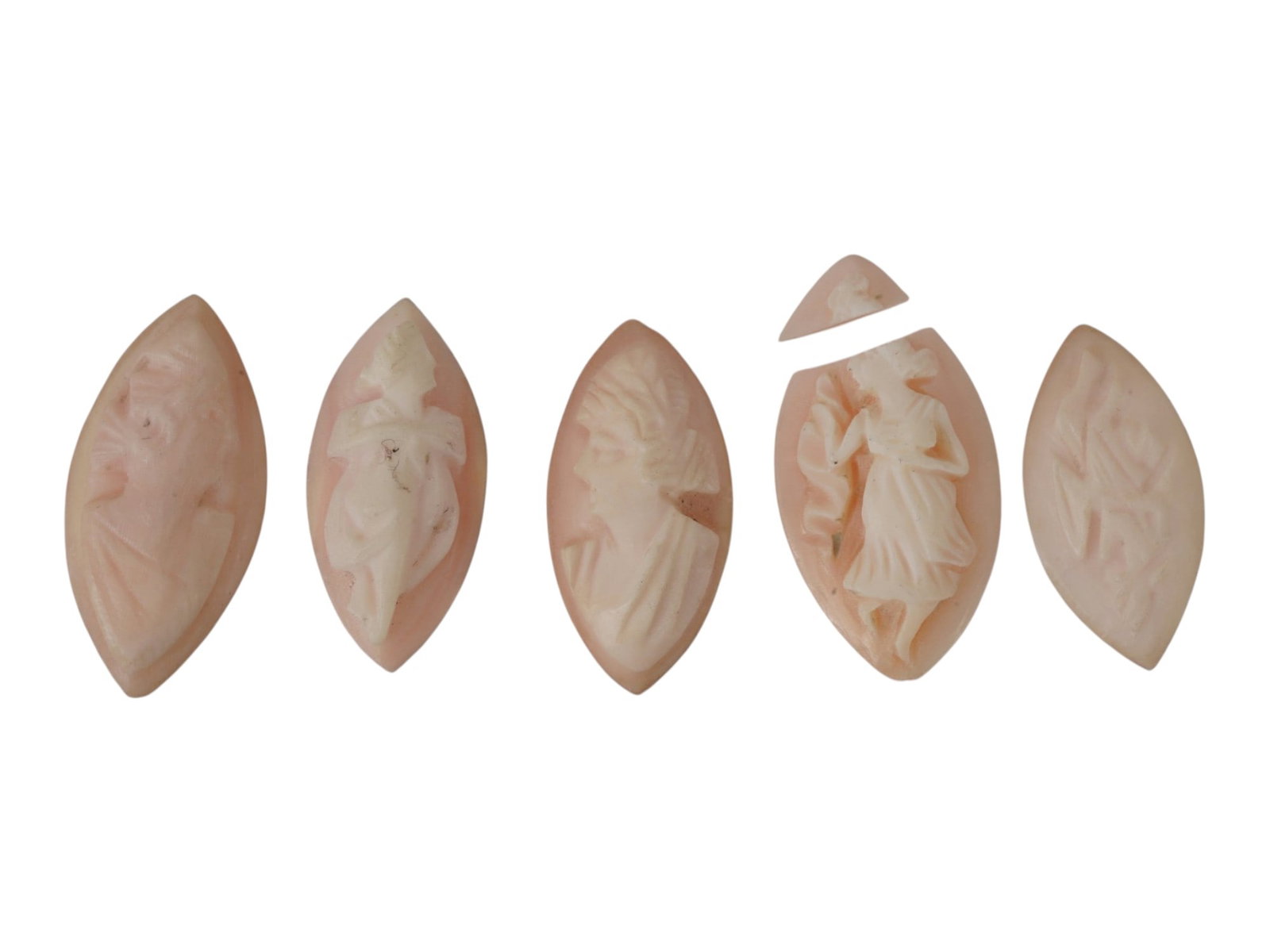 LOT OF FEMALE PORTRAIT CARVED PINK CORAL CAMEOS: A lot of five hand carved pink coral cameos. Each piece depicts a female profile portrait or nymph rendered in high relief. Marquise shape. Collectible Jewelry And Glyptic Art, Sculpture. THIS LOT IS 
