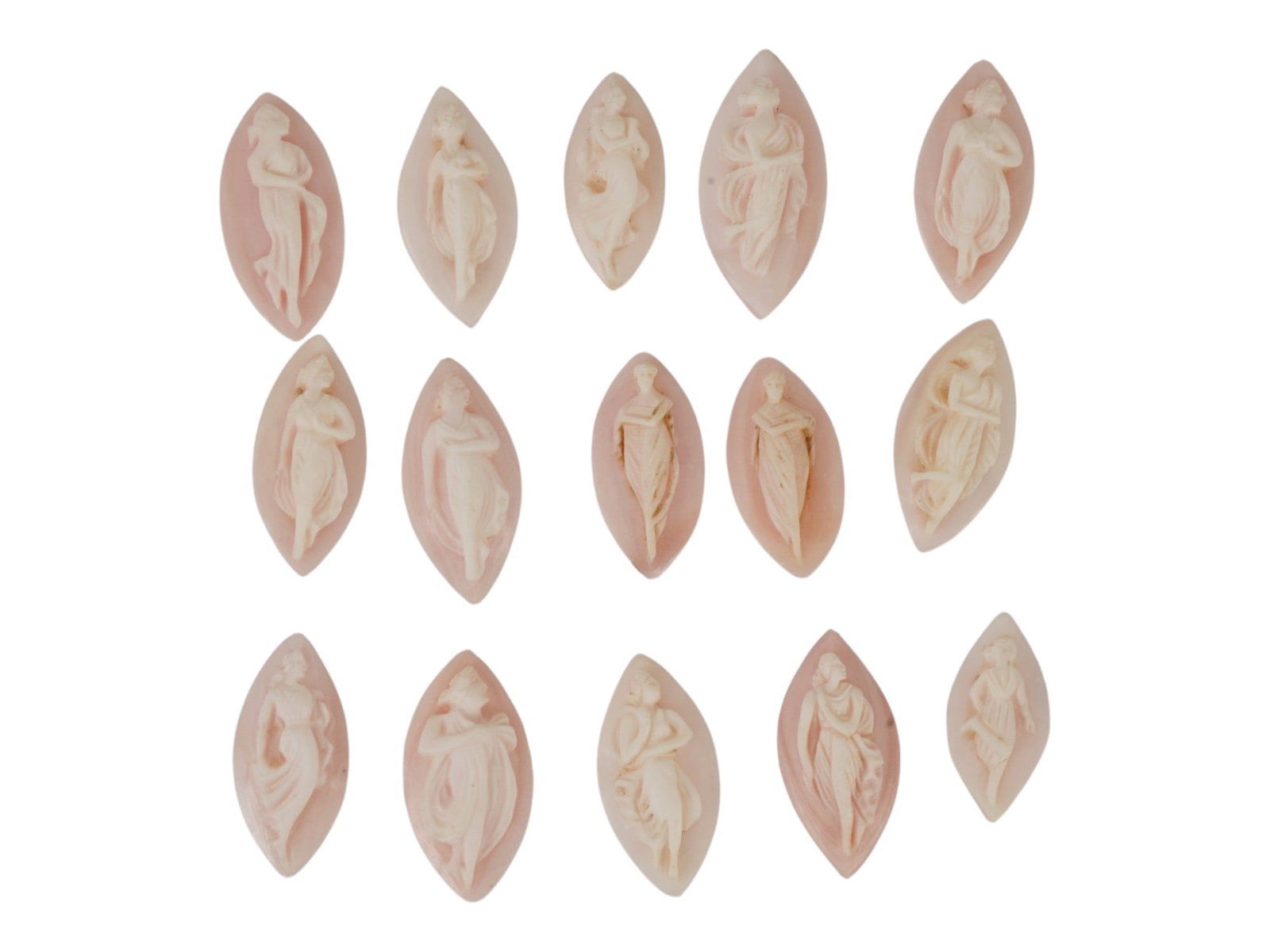 LOT OF NYMPH CARVED PINK CORAL CAMEOS: A lot of 15 hand carved pink coral cameos. Each piece depicts a nymph rendered in high relief. Marquise shape. Collectible Jewelry And Glyptic Art, Sculpture. THIS LOT IS ELIGIBLE FOR A 30-DAY UNCONDI