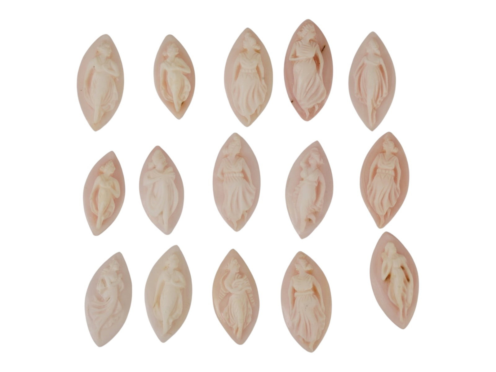 LOT OF NYMPH CARVED PINK CORAL CAMEOS: A lot of 15 hand carved pink coral cameos. Each piece depicts a nymph rendered in high relief. Marquise shape. Collectible Jewelry And Glyptic Art, Sculpture. THIS LOT IS ELIGIBLE FOR A 30-DAY UNCONDI