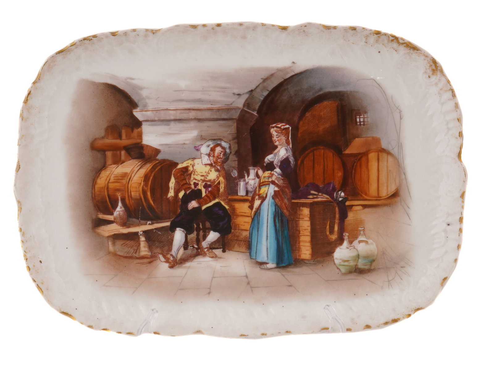 FRENCH LIMOGES PAINTED PORCELAIN DECORATIVE PLATE: A French Limoges porcelain decorative dish or tray. The ware is adorned with a hand painted genre scene after the original painting by Italian artist Tito Conti, 1842 to 1924, titled In the Wine Cella