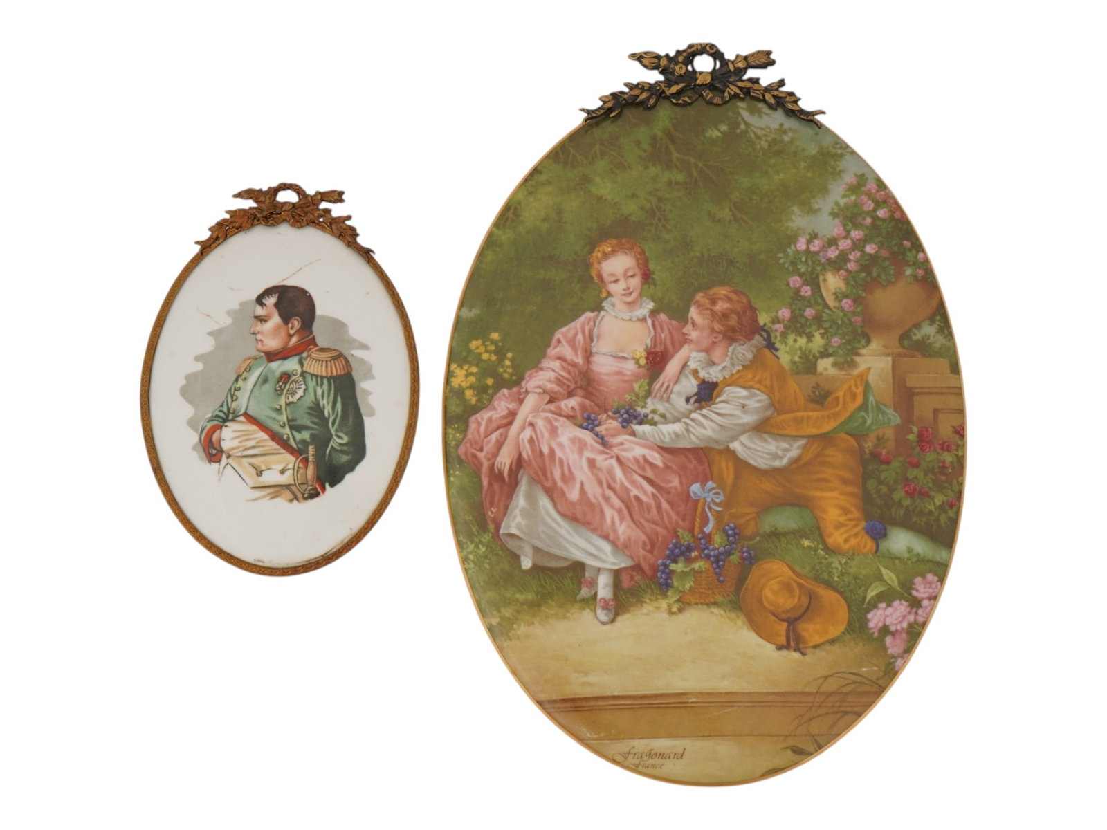 PAIR OF FRENCH LIMOGES PORCELAIN WALL PLAQUES: A lot of two vintage French Limoges porcelain plaques with polychrome transfer-printed pictures. Oval format, brass framing. First. A portrait of Napoleon Bonaparte. Second. Rococo galant scene after 