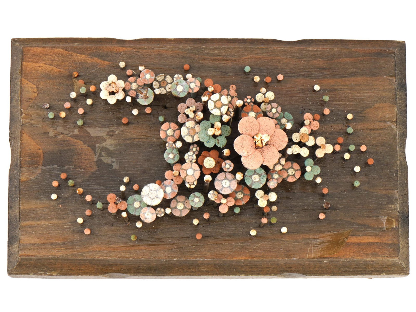 ABSTRACT SCULPTURE OF PAINTED NAILS ON WOOD BASE: An abstract wall decor sculpture made of nails on wood base. The sculpture consists of numerous nails of varying lengths hammered into a rectangular wooden base forming floral motifs. The nails are ar